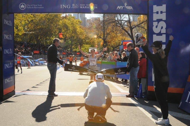 Breaking the tape for the Foot Locker 5 Borough Challenge @ the NYC Marathon (Nov 2011)