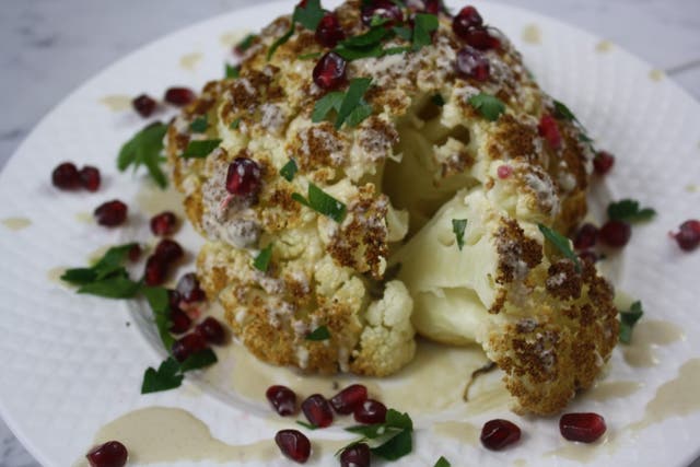 Whole Roasted Cauliflower with Fresh Pomegranate Tahini Sauce