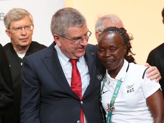 Loroupe (right) poses with IOC president IOC president Thomas Bach.