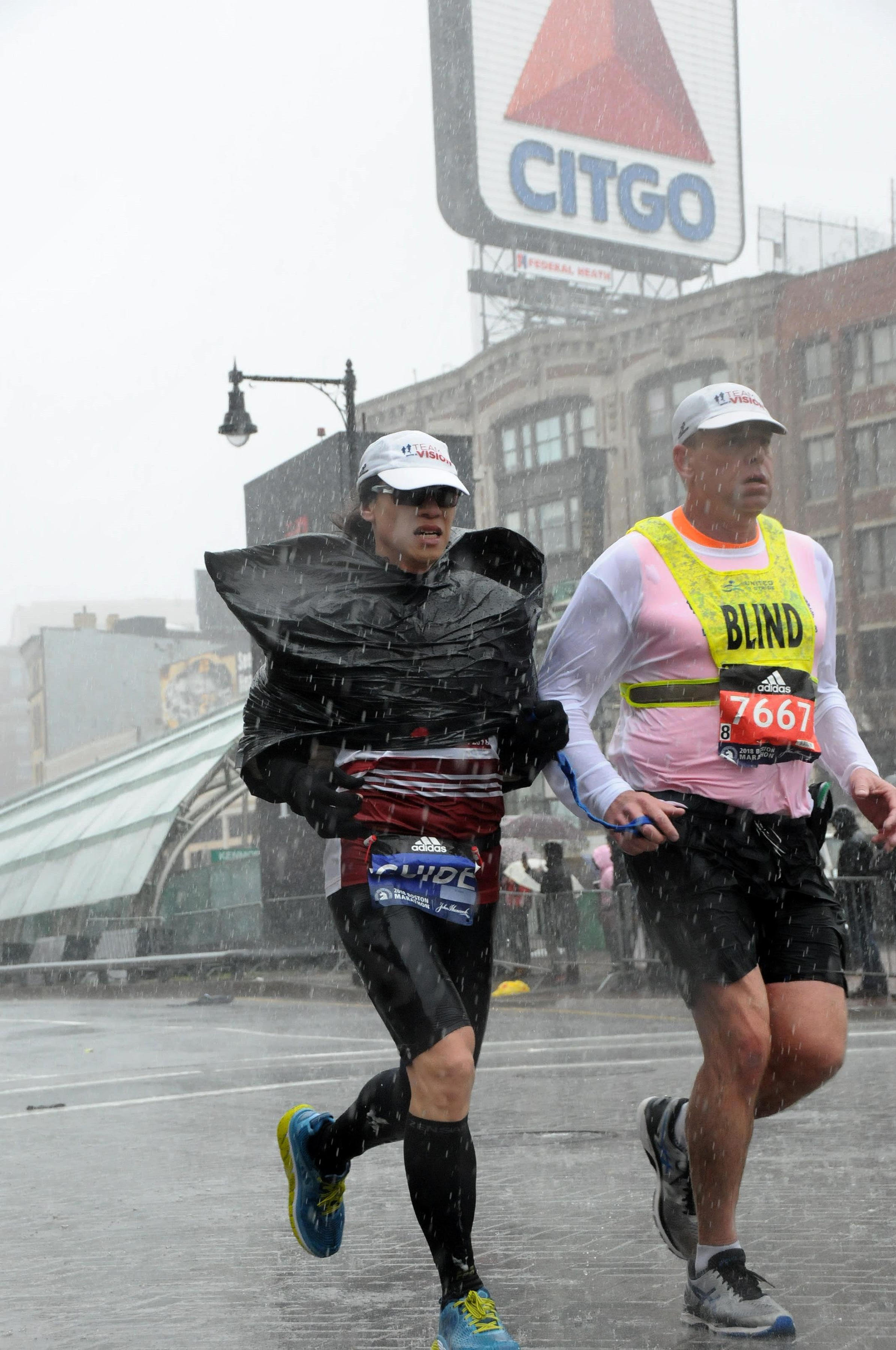 Vivienne Hau guides a blind runner at the Boston Marathon. Next, she'll help the first visually impaired team at the Hood to Coast Relay.