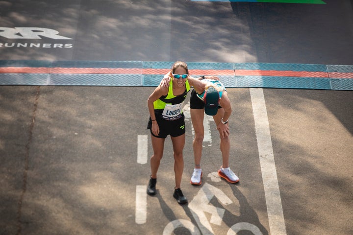 Desiree Linden and Kellyn Taylor celebrate at the 2019 New York City Marathon finish line.