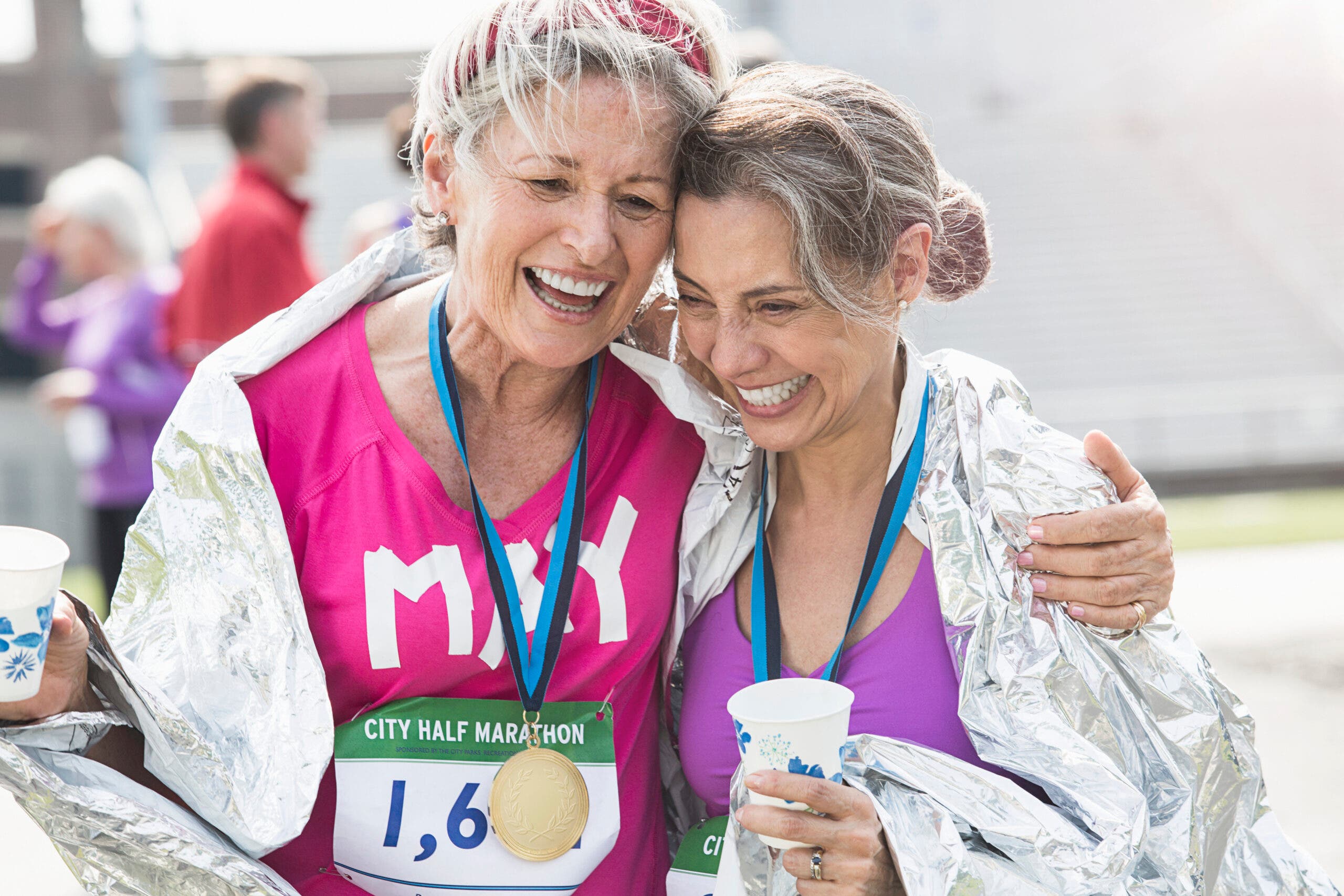 two women finish a half marathon together