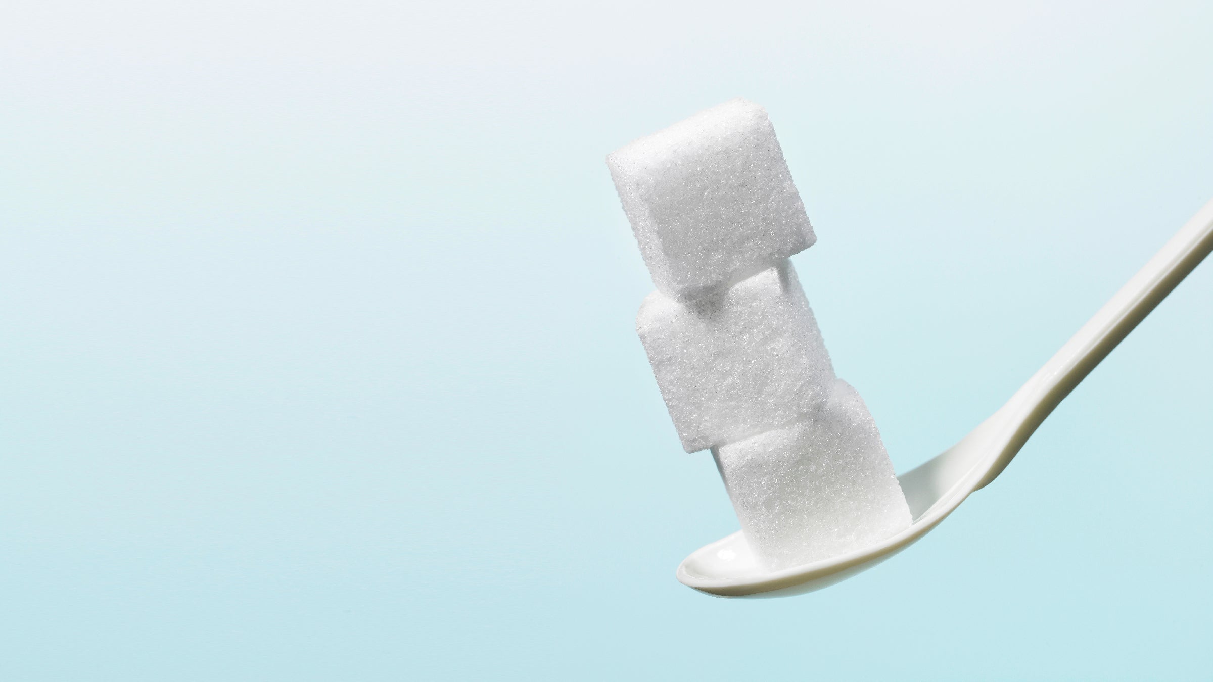 sugar cubes on spoon