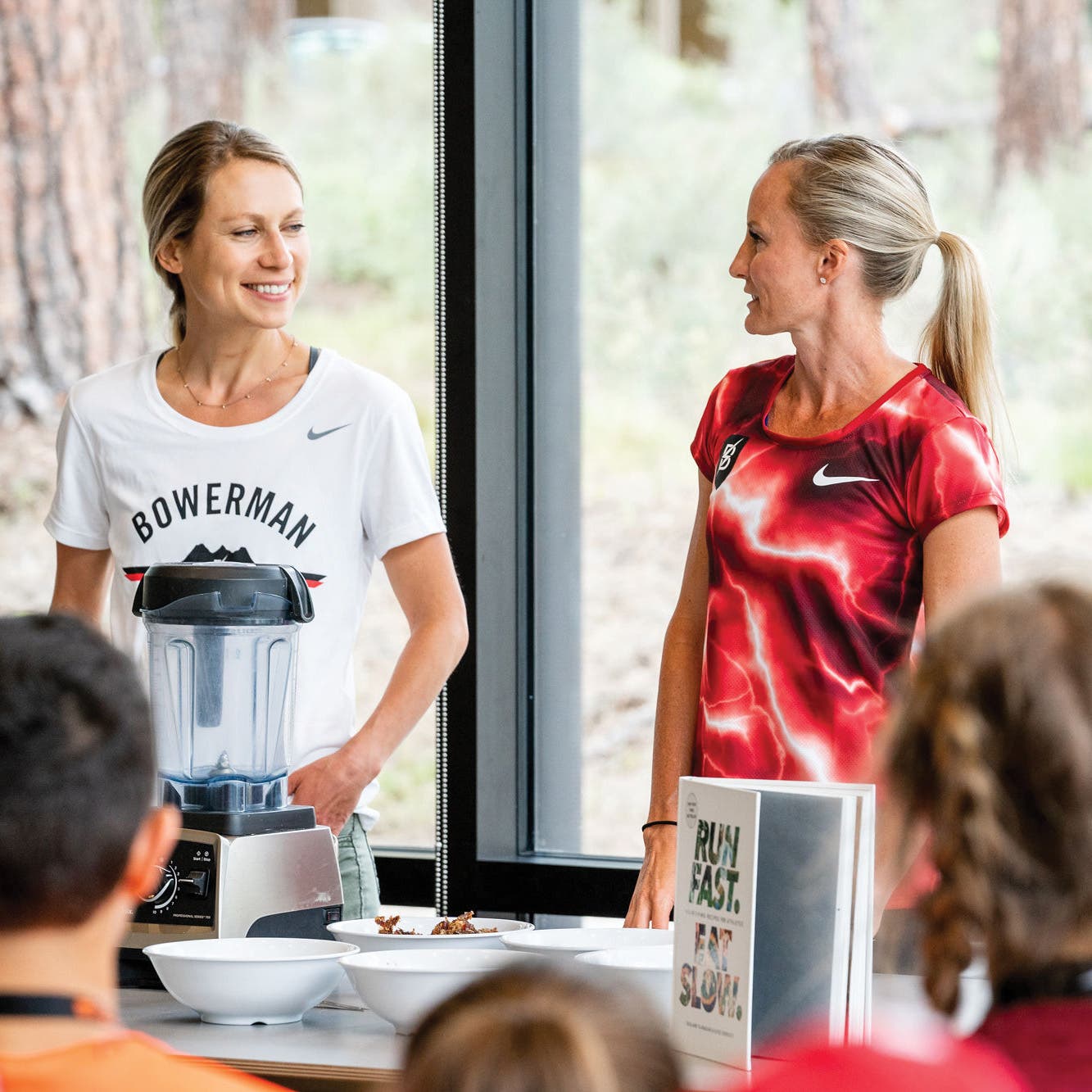 Elyse Kopecky and Flanagan share cooking tips with a group