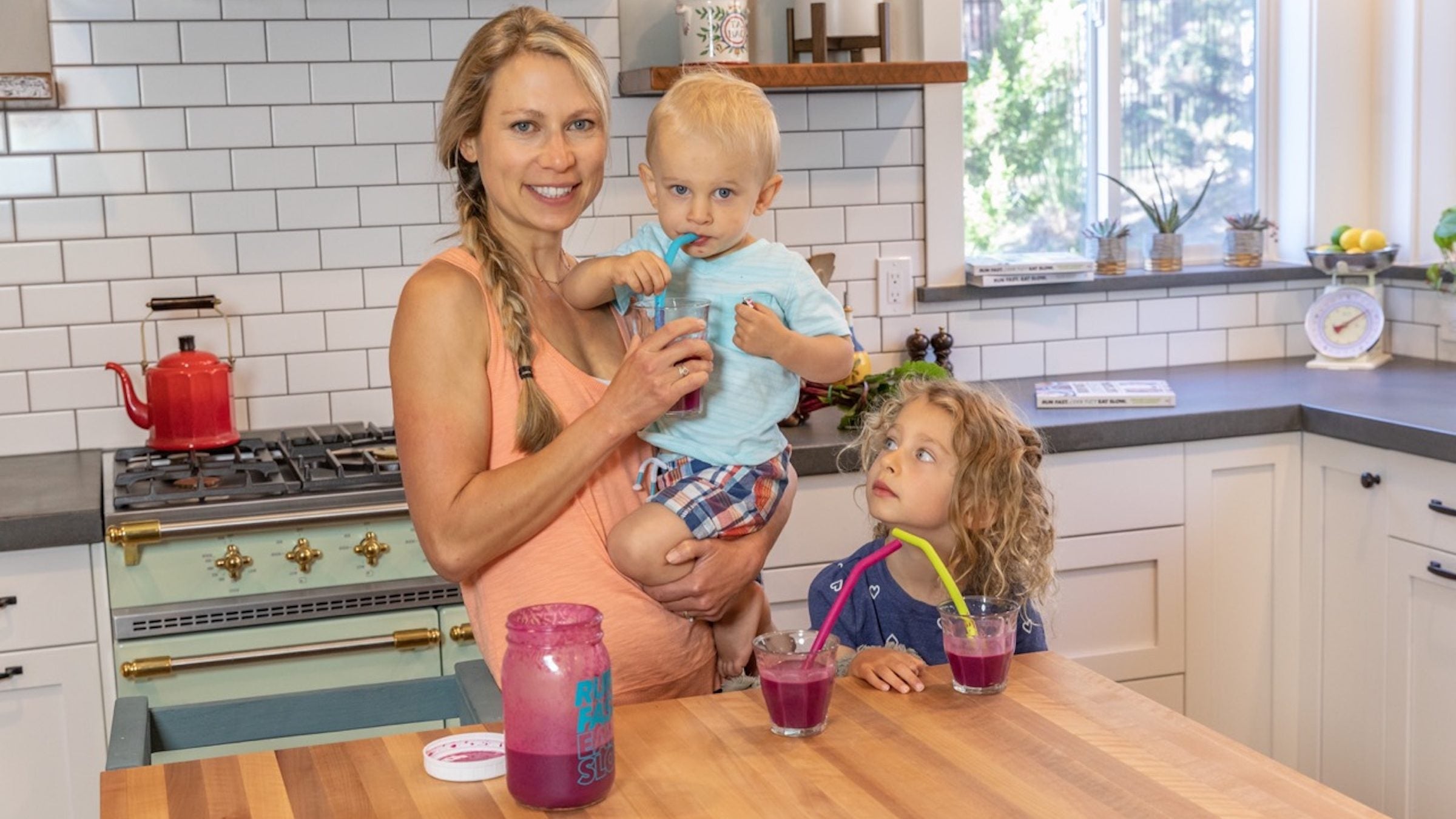 Elyse Kopecky drinking a smoothie with her children to help maintain a healthy immune system
