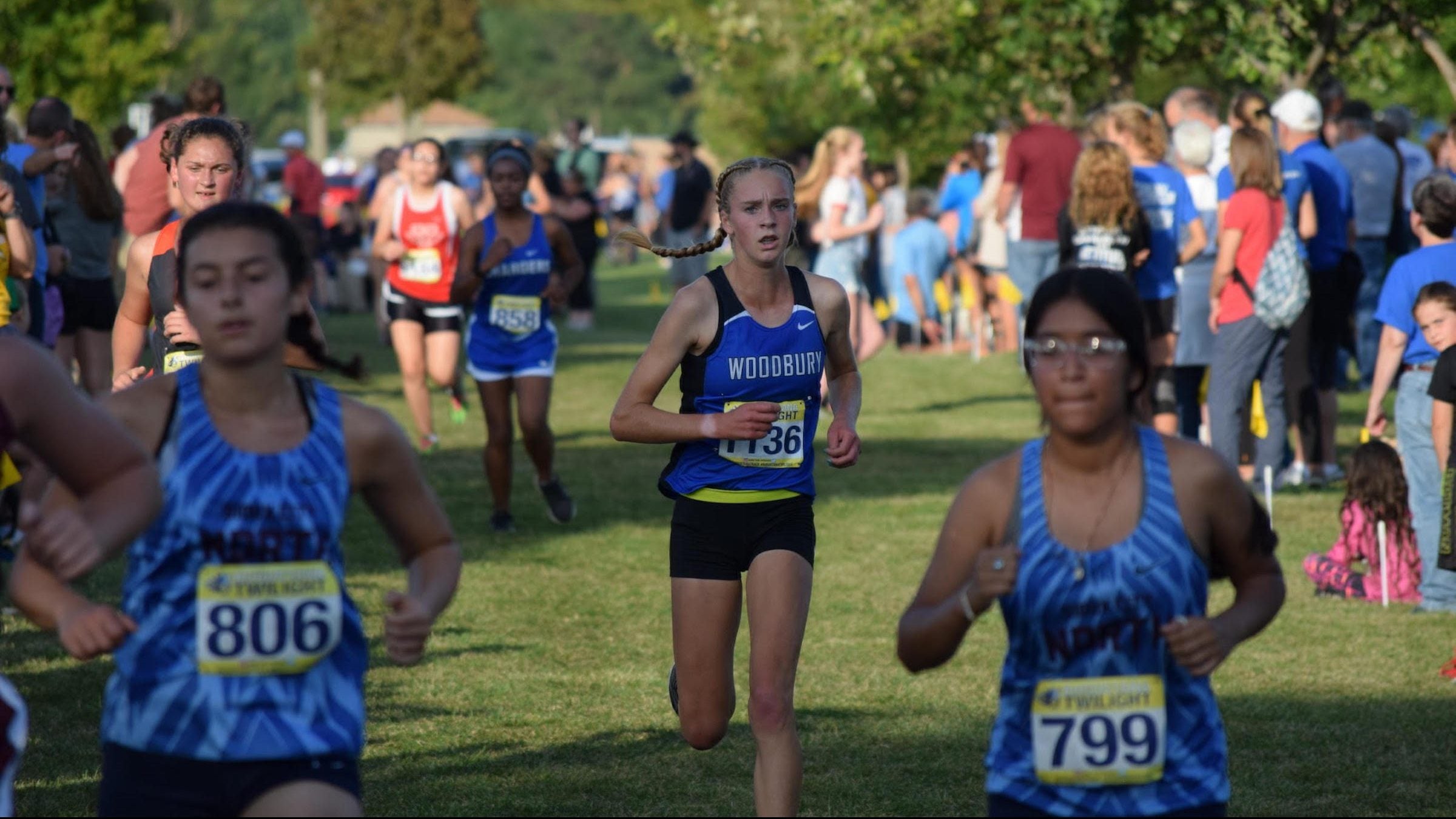 Tierney Wolfgram runs in high school cross-country meet