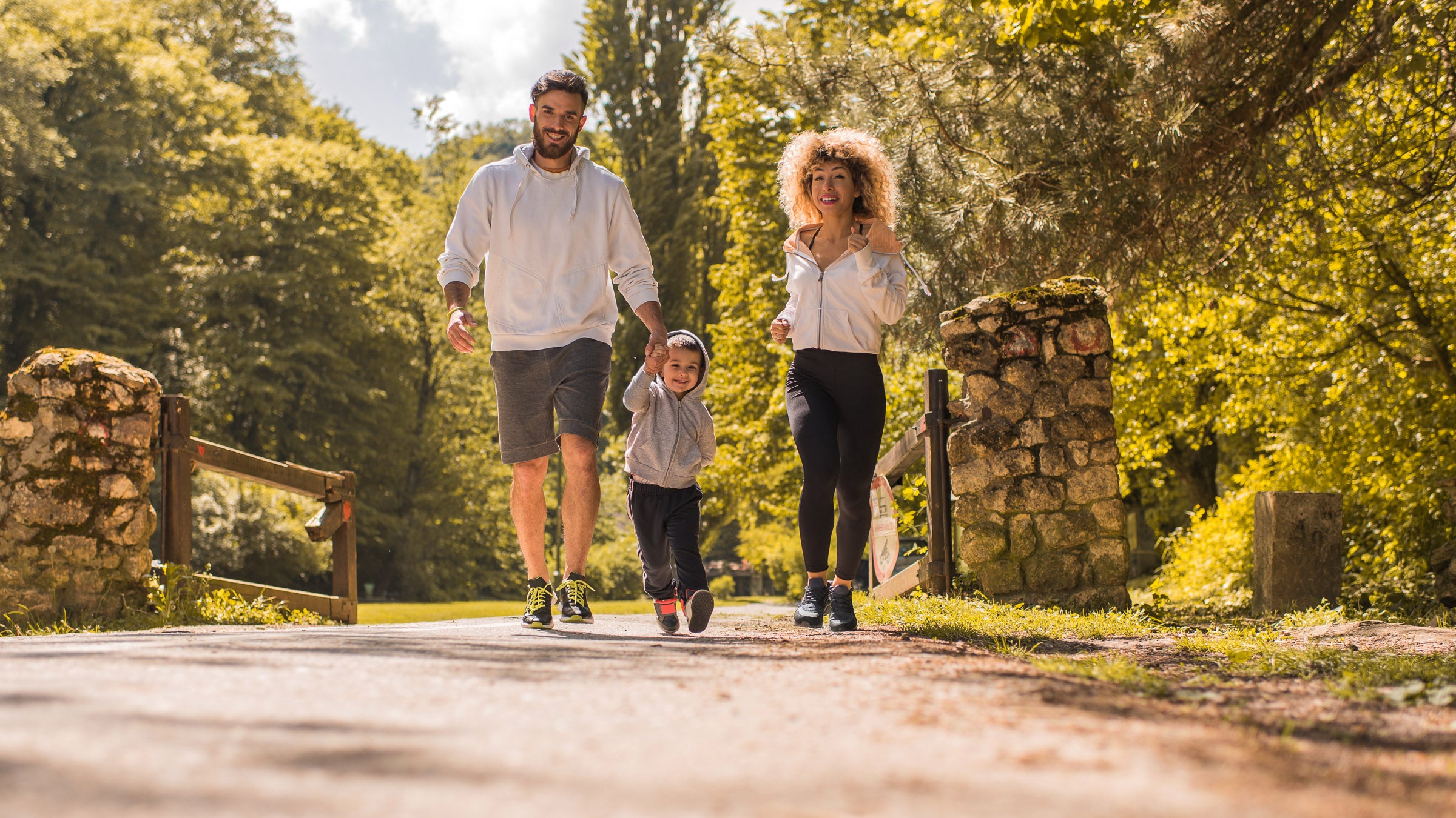 Family running in the park.