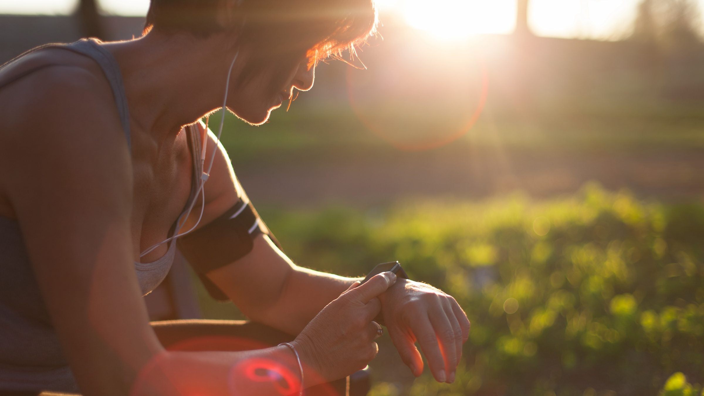 Female runner using smart watch