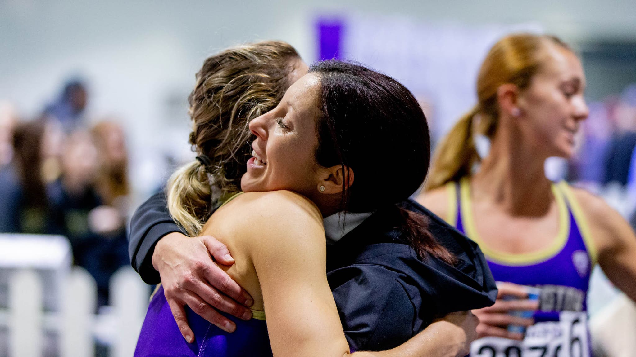 Coach Maurica Powell hugs one of her athletes
