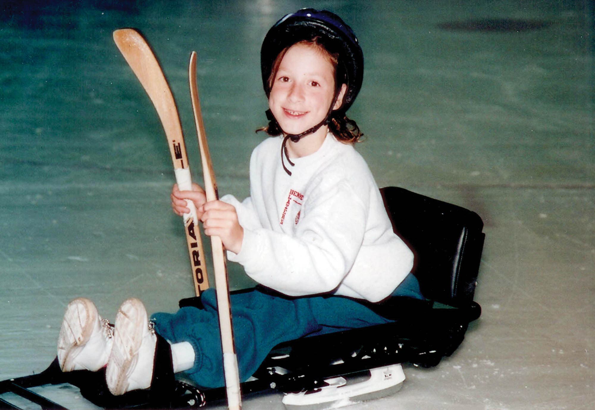 Young Tatyana McFadden on the ice in a hockey sled