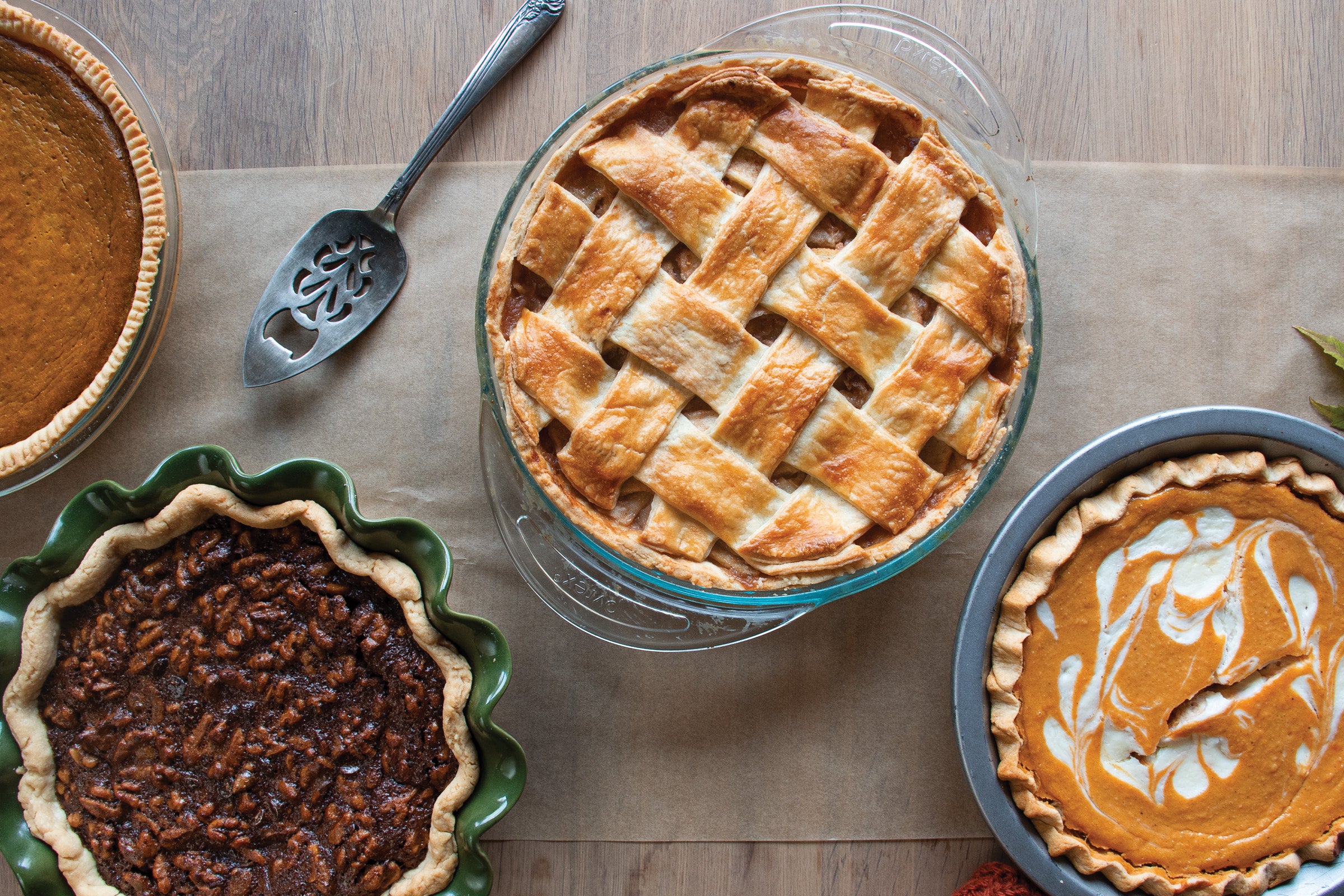 Four pies on a wooden table