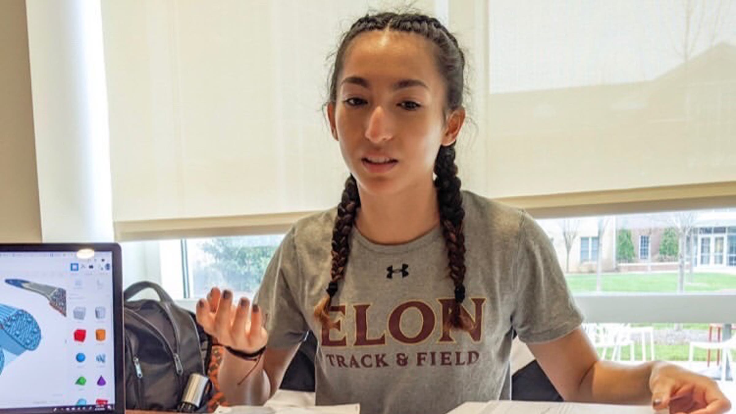 Madison George working on her pole-vaulting shoe design.