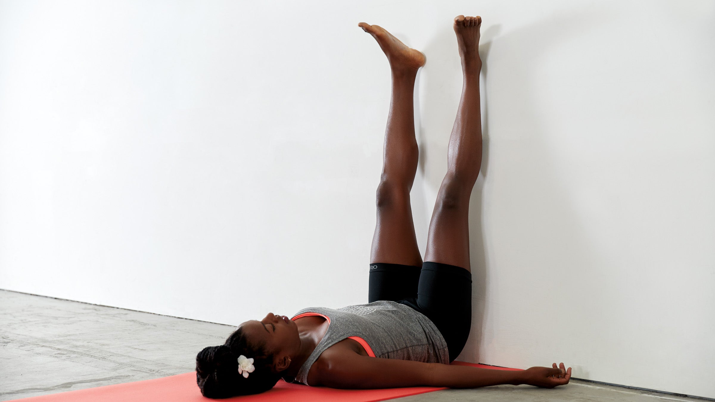 Alysia Montano practices a restorative yoga pose.