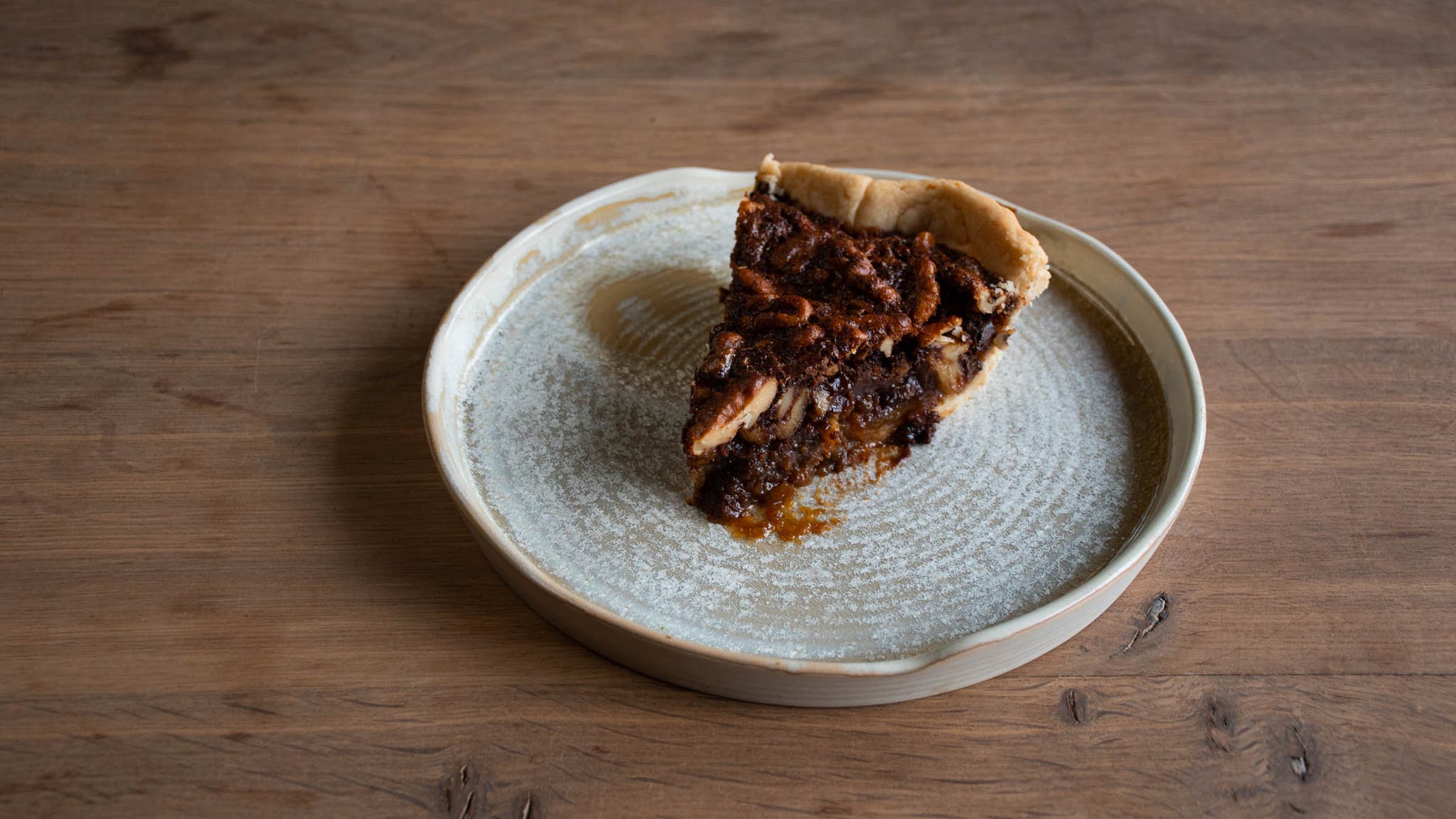 Dark chocolate walnut pie slice