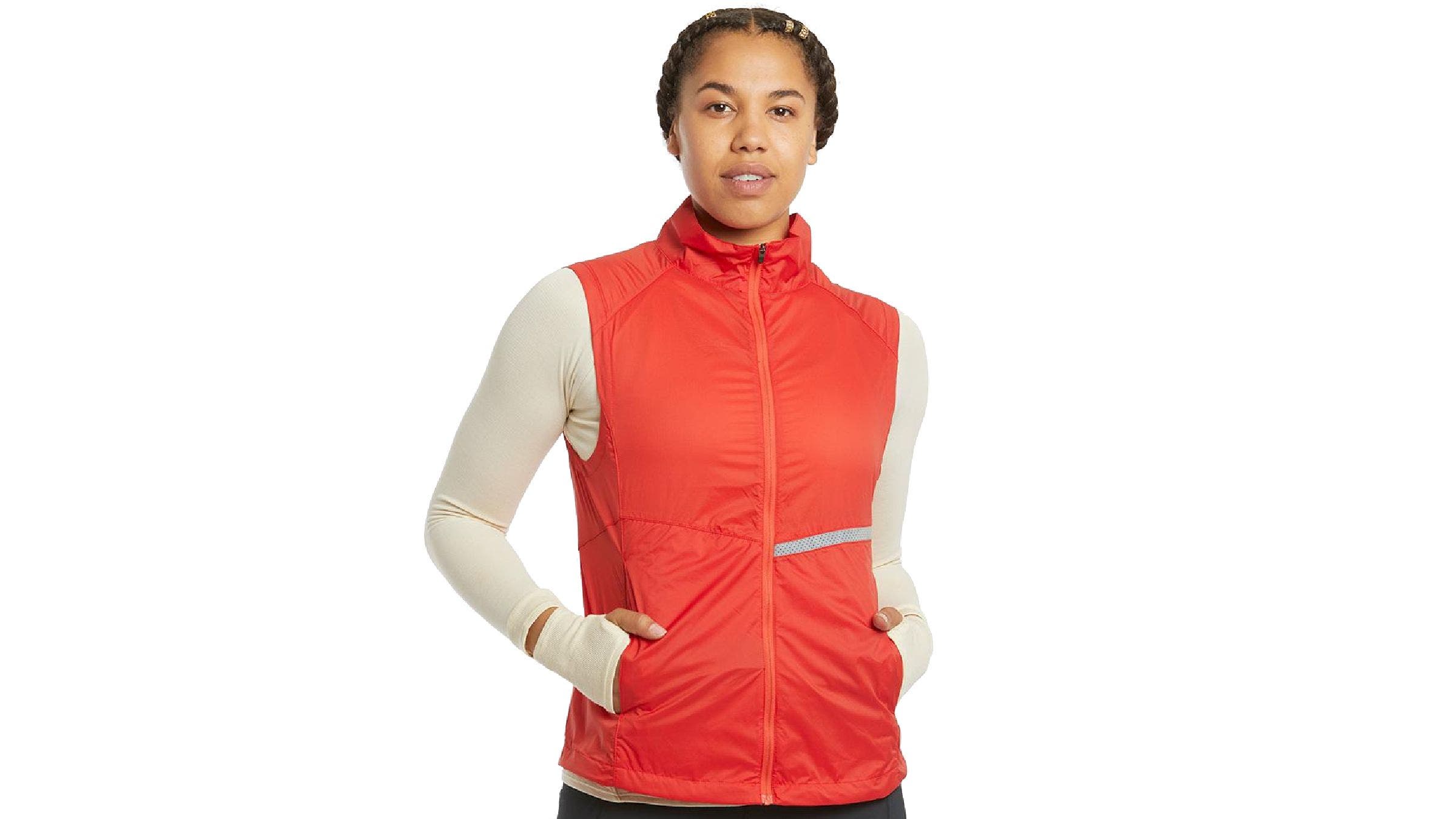Oiselle Reflective Vigor Vest in orange is one of our picks for best running vests for women