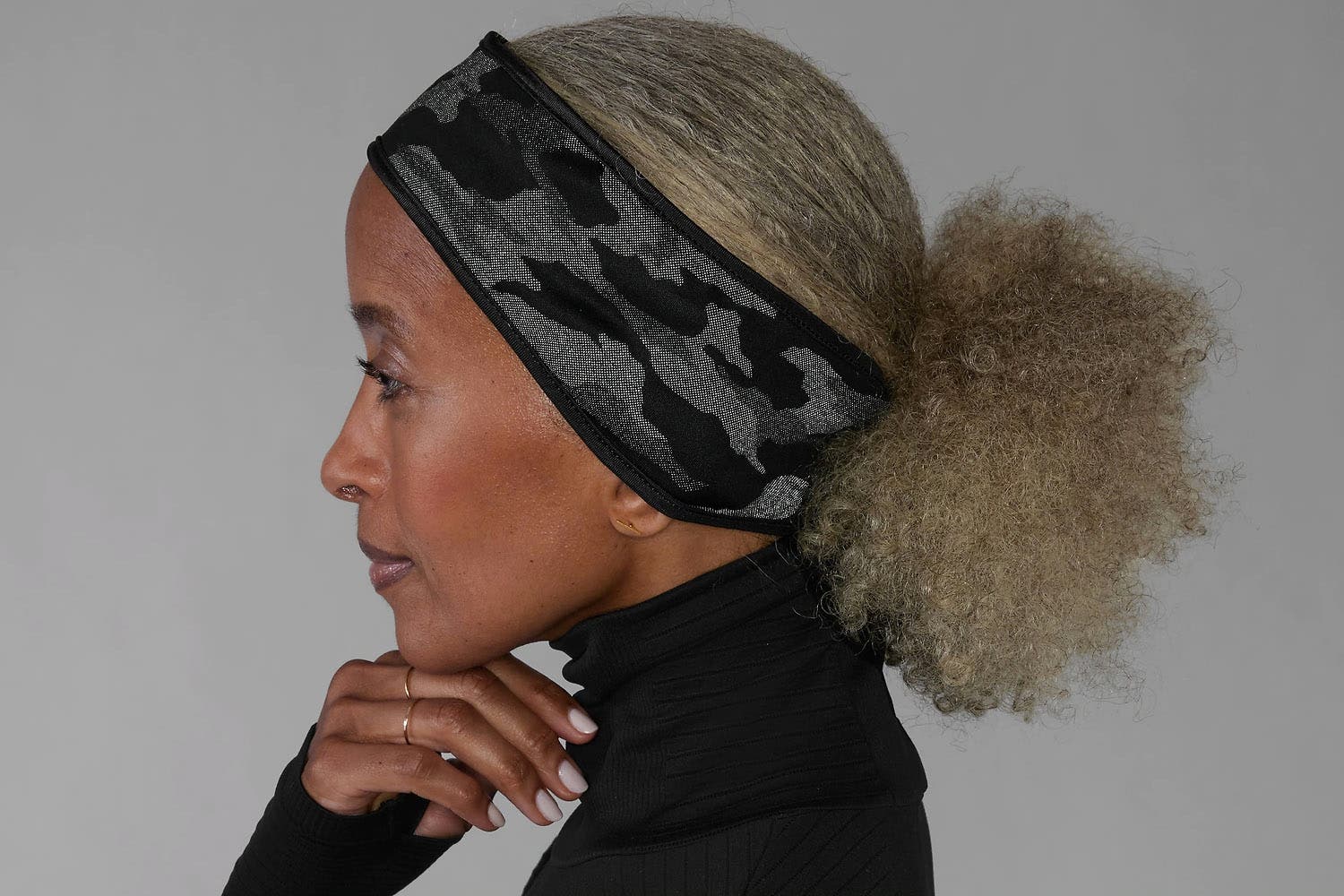 older black woman wearing a running headband for winter from Athleta