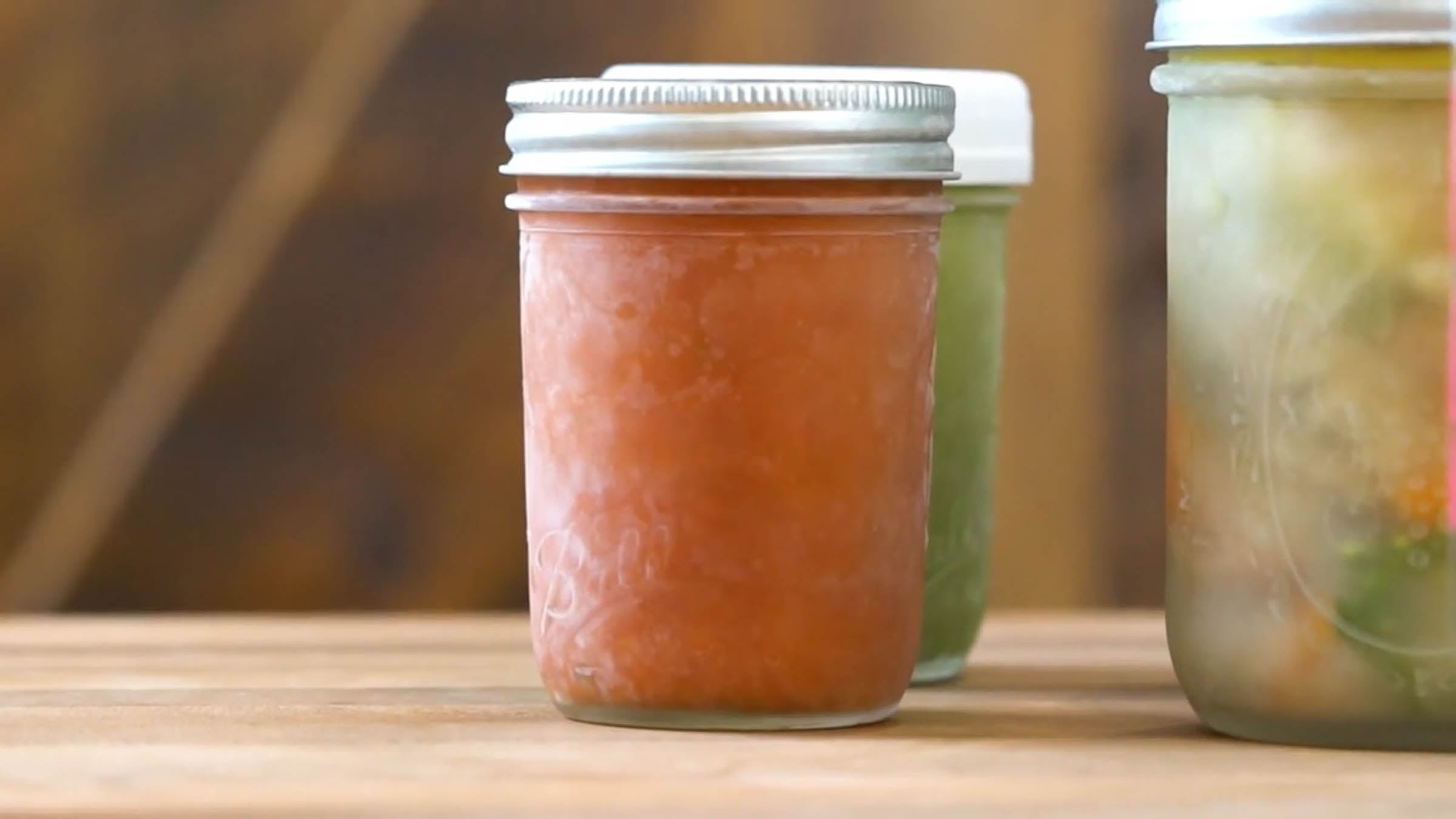 Mason jars of frozen food on a counter