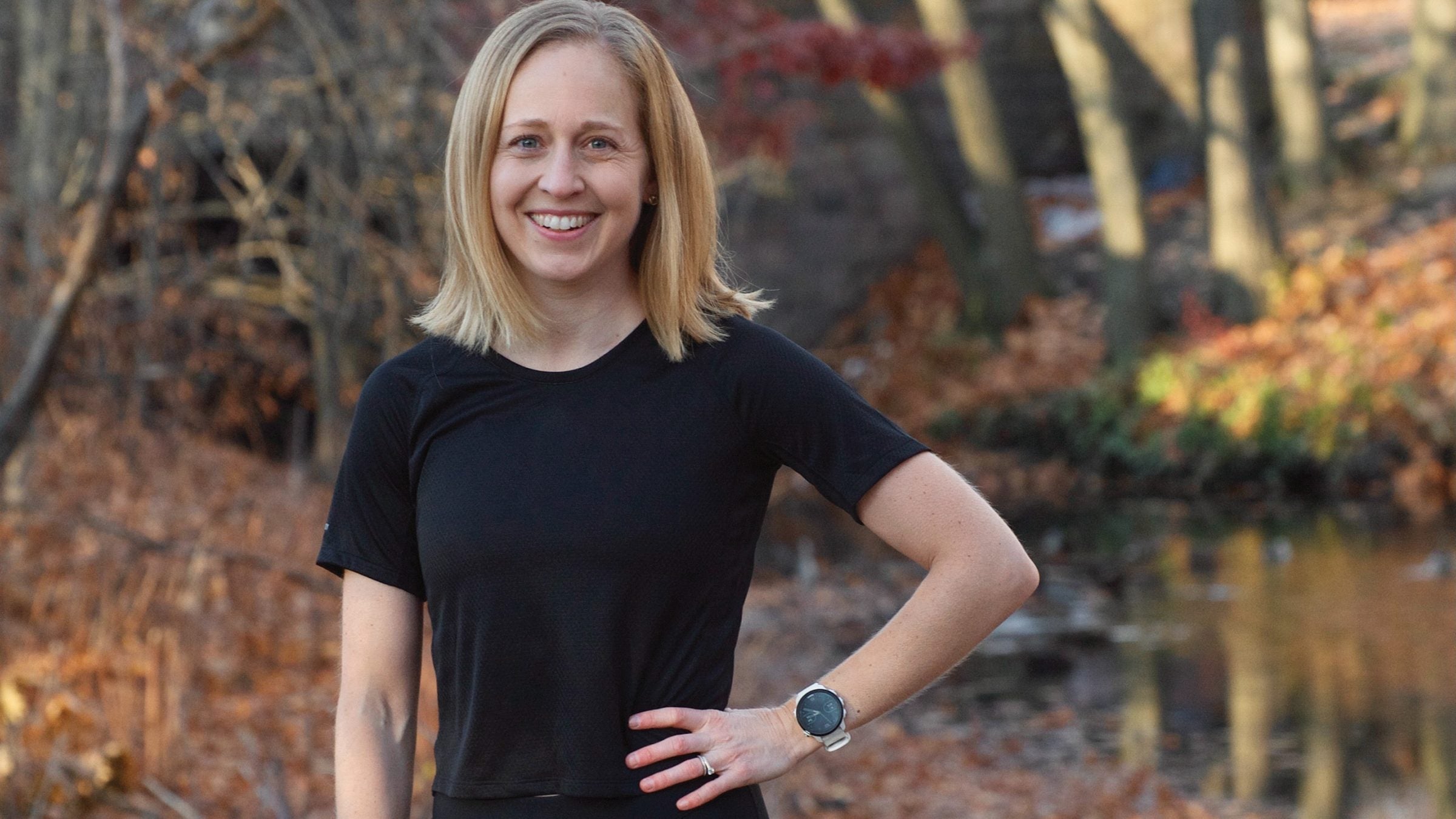 Kaitlin Goodman poses in a black tee shirt on a fall afternoon
