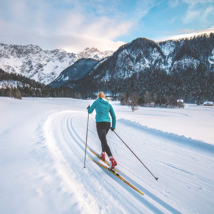 woman skiing uphill, or ski mountaineering