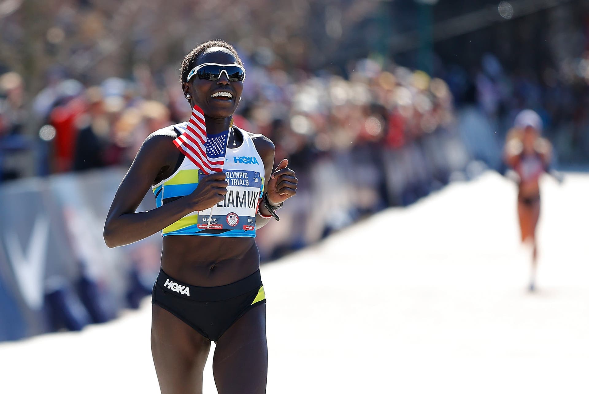 Aliphine Tuliamuk reacts as she crosses the finish line to win the Women's U.S. Olympic marathon team trials on February 29, 2020 in Atlanta, Georgia.