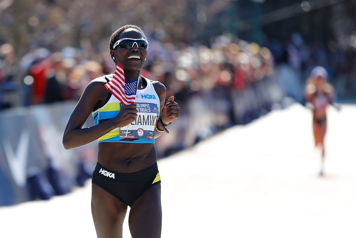 Aliphine Tuliamuk reacts as she crosses the finish line to win the Women's U.S. Olympic marathon team trials on February 29, 2020 in Atlanta, Georgia.