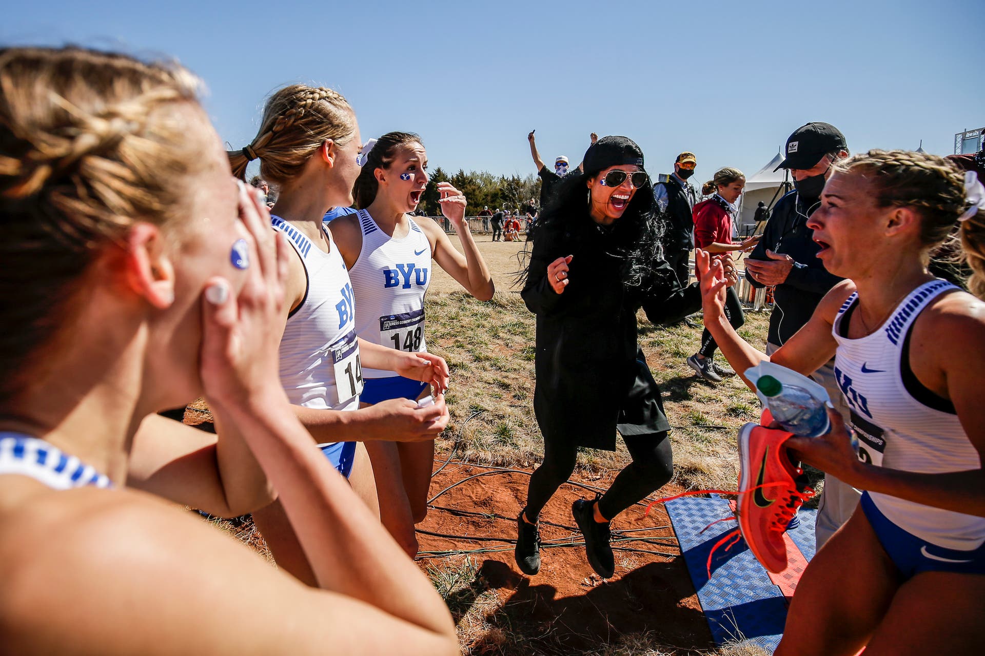 Diljeet Taylor and her women's team celebrate at the NCAA track and field championships