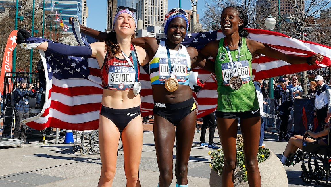 Molly Seidel, Aliphine Tuliamuk, and Sally Kipyego pose after finishing in the top three of the Women's 2020 U.S. Olympic marathon team trials.