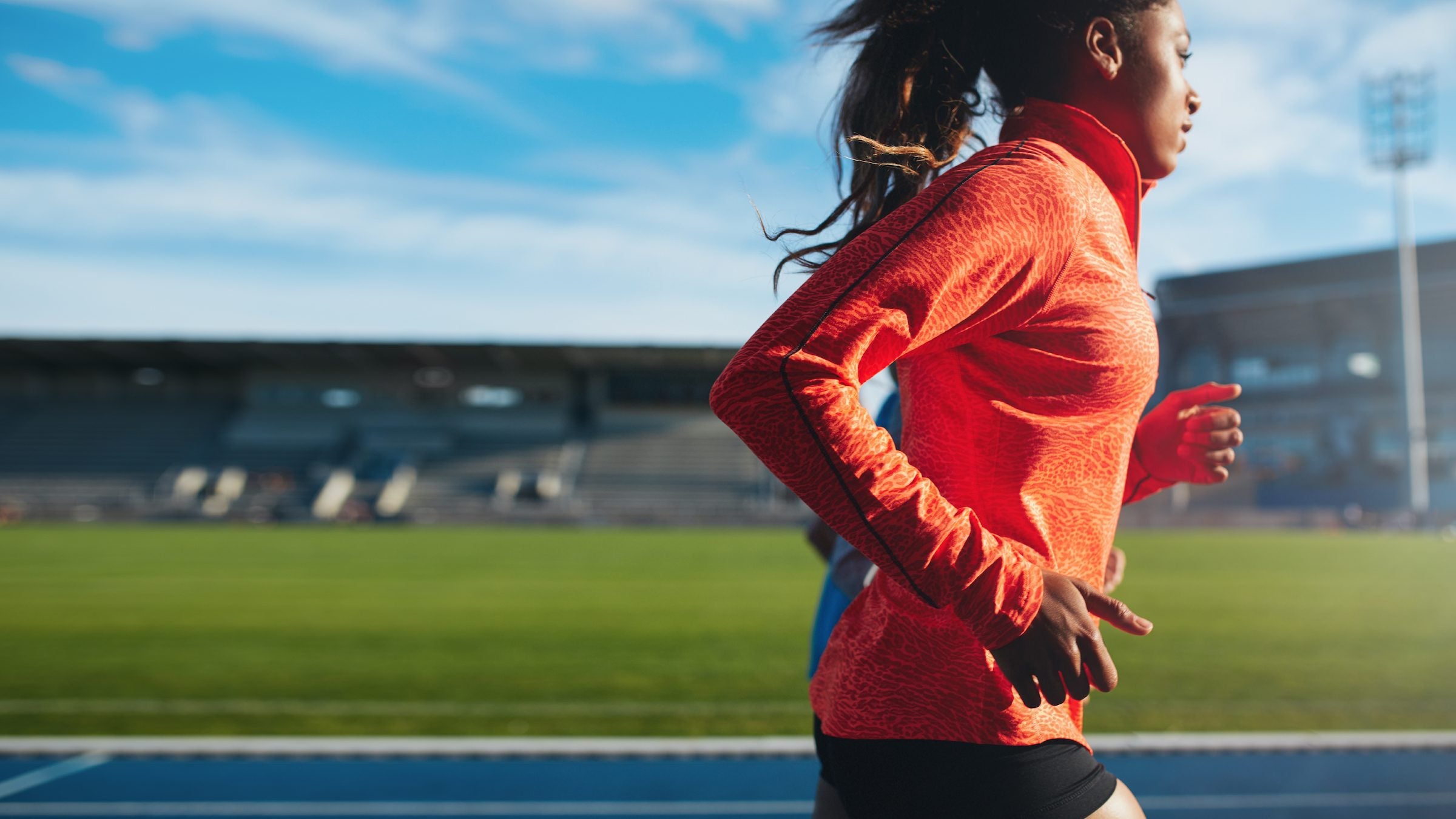 woman running on a track