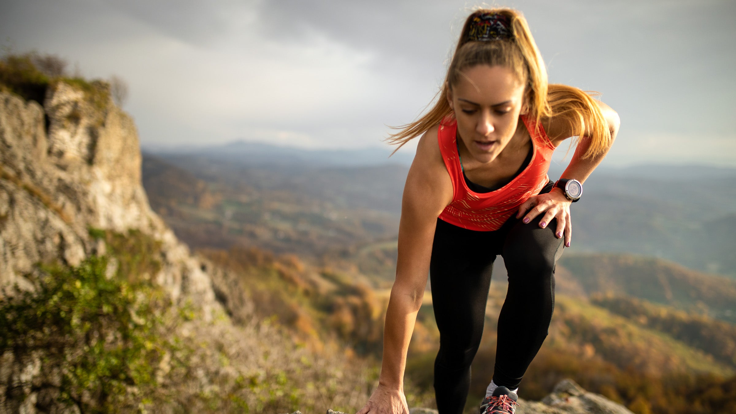 Young woman running on mountain