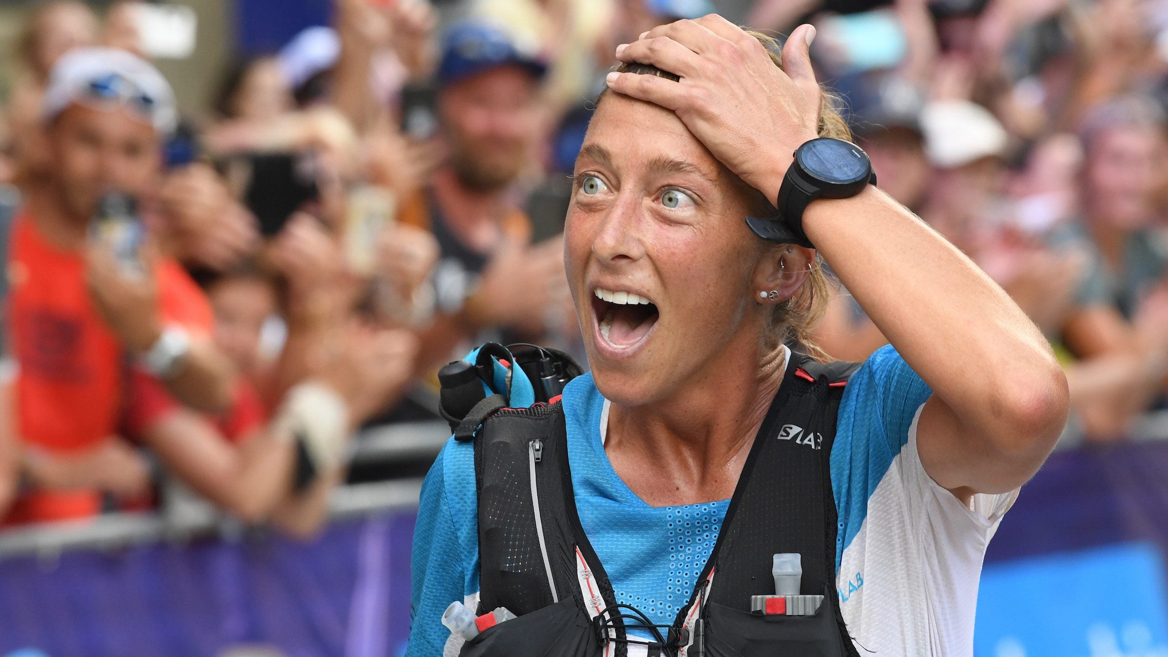 USA's Courtney Dauwalter reacts after winning the 170 km Mount Blanc Ultra Trail (UTMB) race around the Mont-Blanc crossing France, Italy and Swiss, on August 31, 2019 at the end of the race near Chamonix. (Photo by JEAN-PIERRE CLATOT / AFP) (Photo credit should read JEAN-PIERRE CLATOT/AFP via Getty Images)