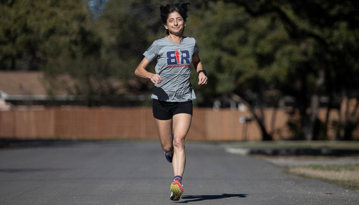 Liza Howard running on a paved street