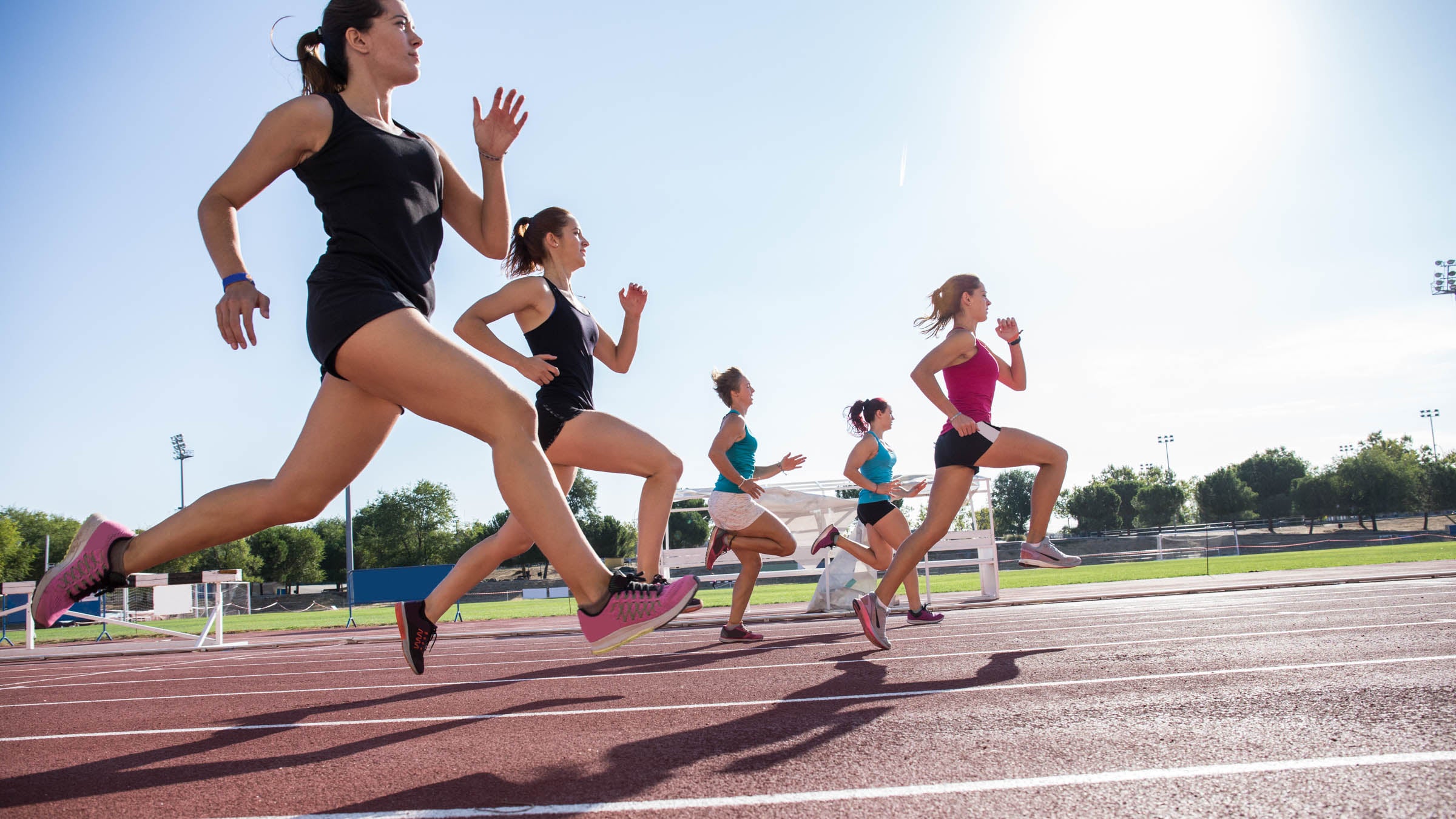 Group of women running on a track