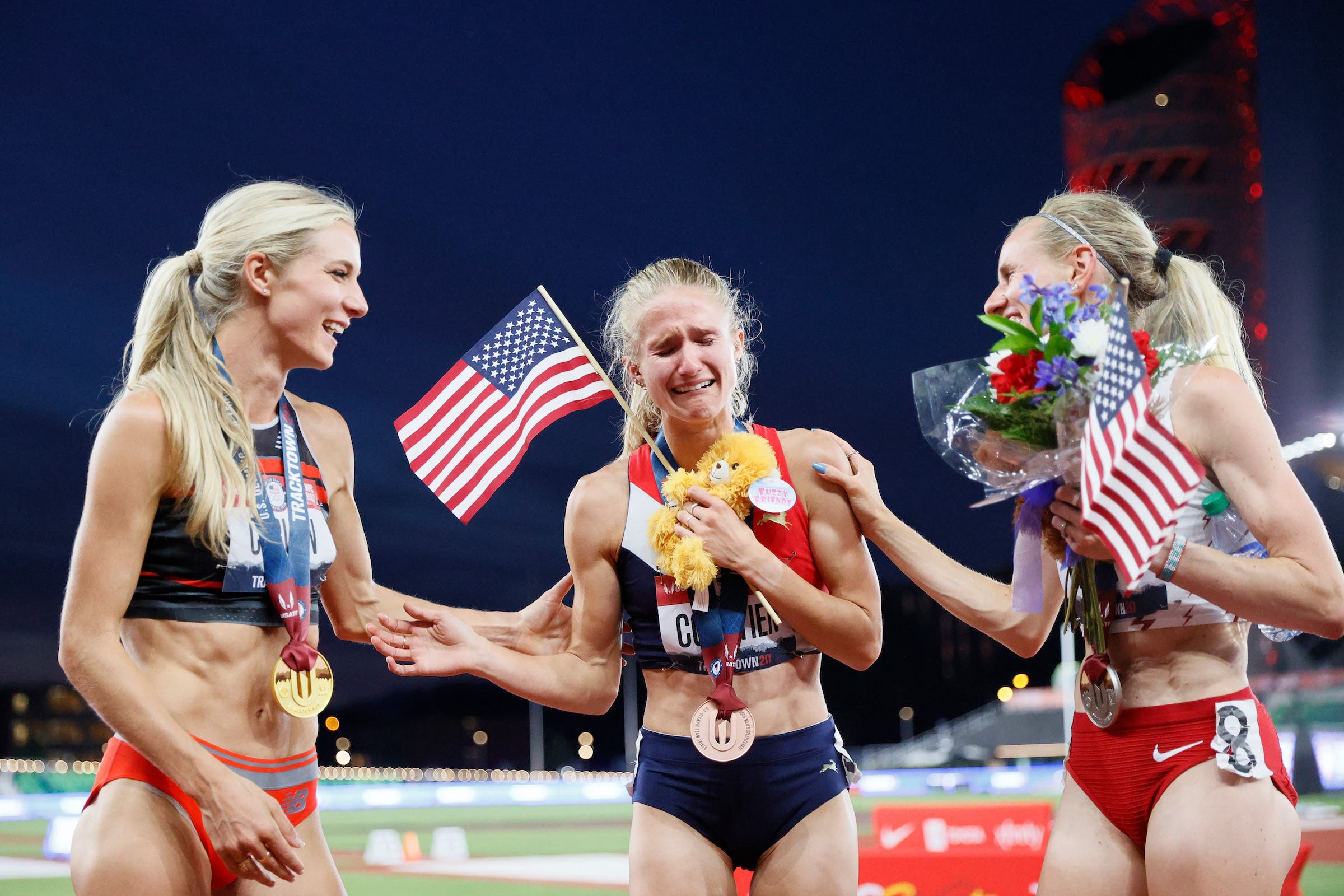 Emma Coburn, Courtney Frerichs and Val Constien celebrate after competing in the Women's 3,000 Meter Steeplechase Final on day seven of the 2021 U.S. Olympic Trials at Hayward Field on June 24, 2021 in Eugene, Oregon.