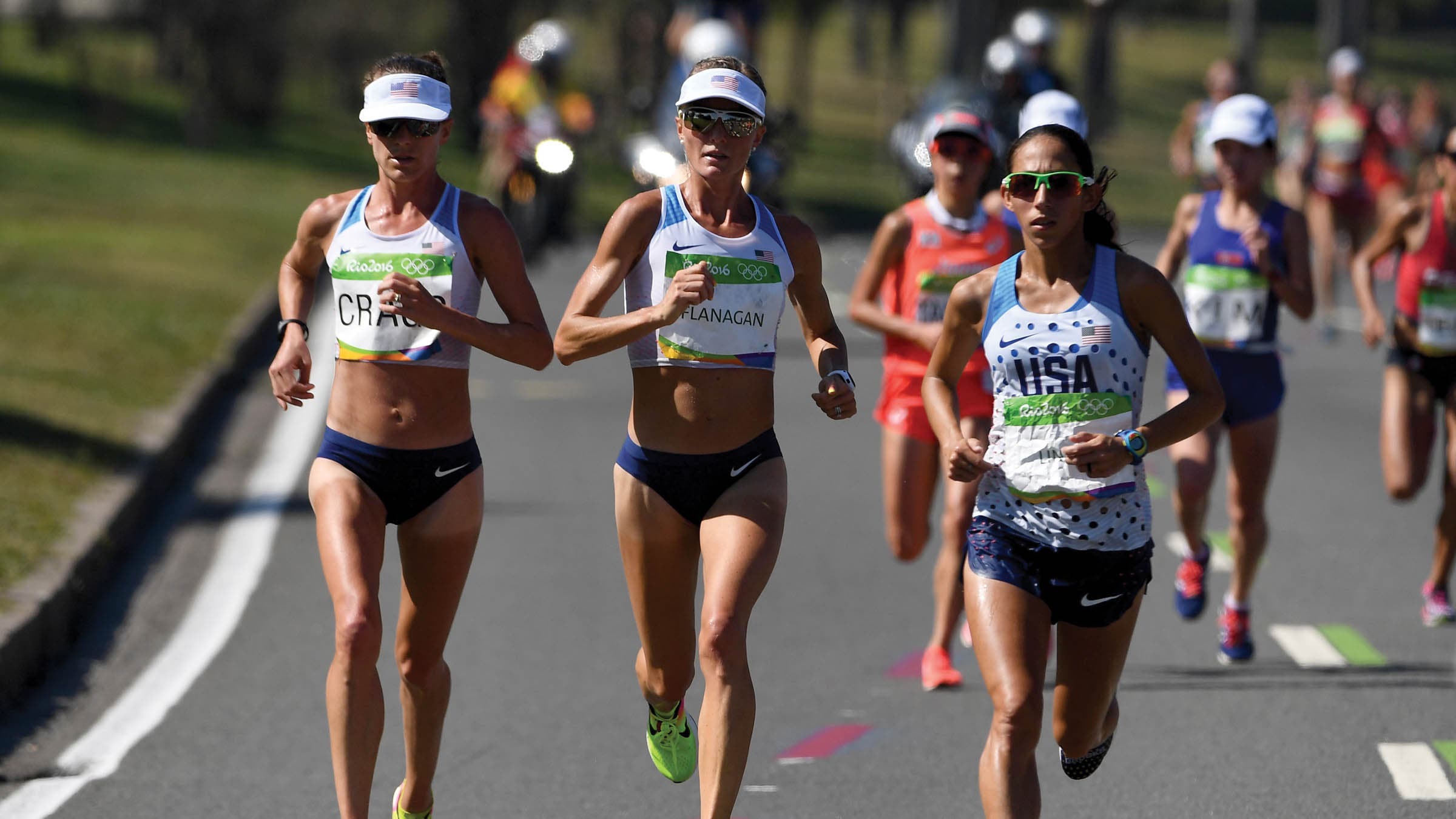 Amy Cragg, Shalane Flanagan, and Desiree Linden running side by side