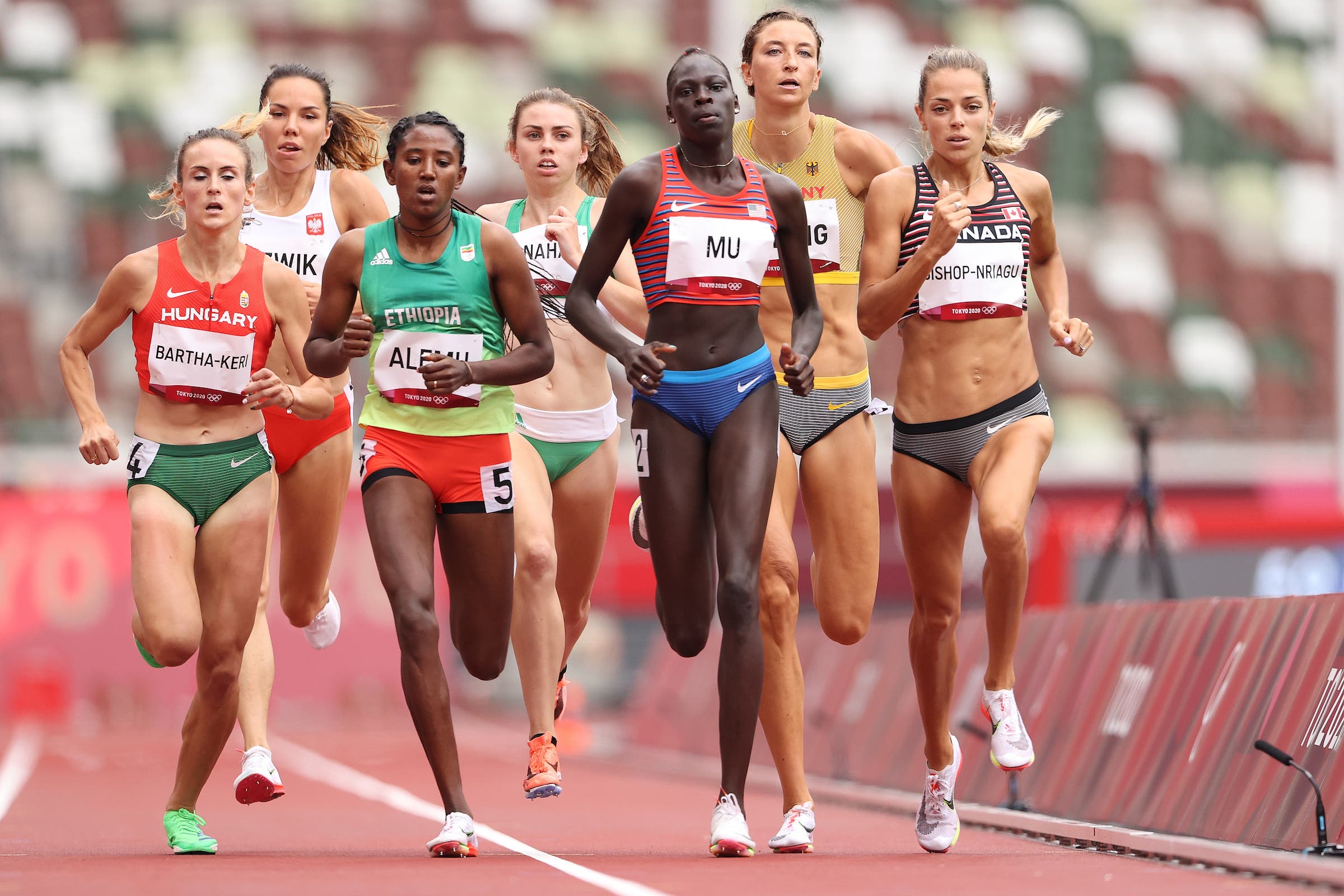 Habitam Alemu of Team Ethiopia, Athing Mu of Team United States, and Melissa Bishop-Nriagu of Team Canada compete during round one of the women's 800-meter heats on day seven of the Tokyo 2020 Olympic Games at Olympic Stadium on July 30, 2021 in Tokyo, Japan. 