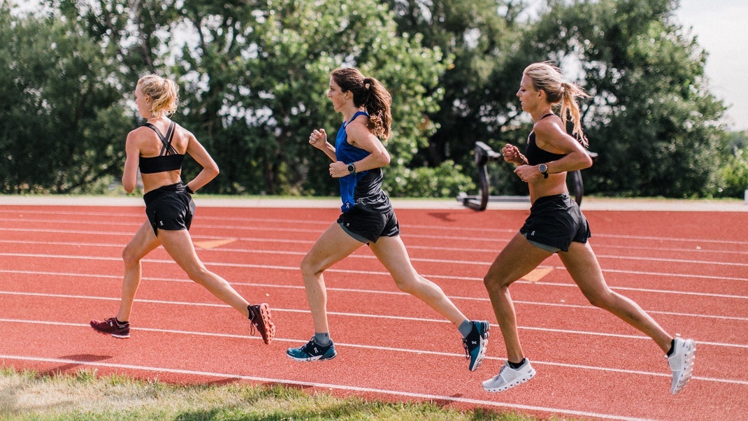 Alicia Monson, coached by Dathan Ritzenhein, does a workout with her teammates on a track