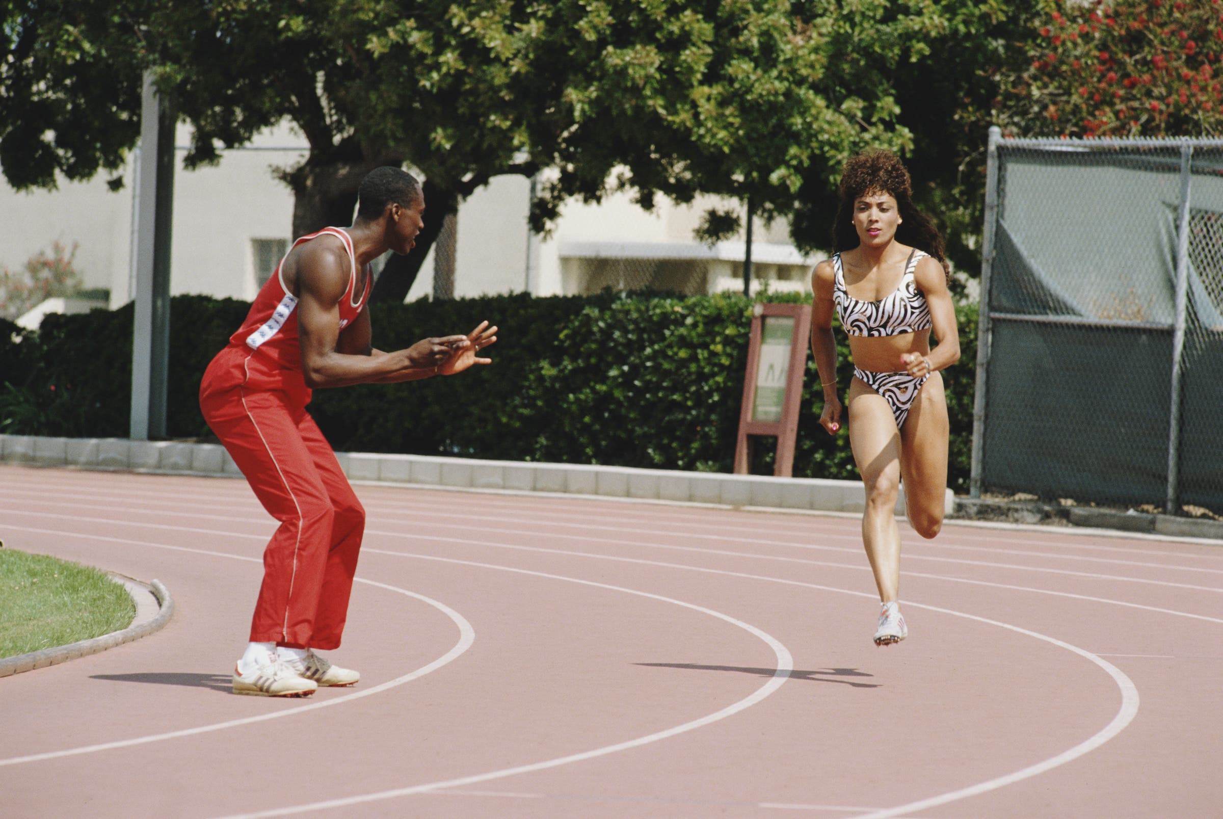 World and Olympic athletics champion Florence Griffith-Joyner of the United States (1959 - 1998) being coached by her husband Olympic triple jump champion of 1984 Al Joyner