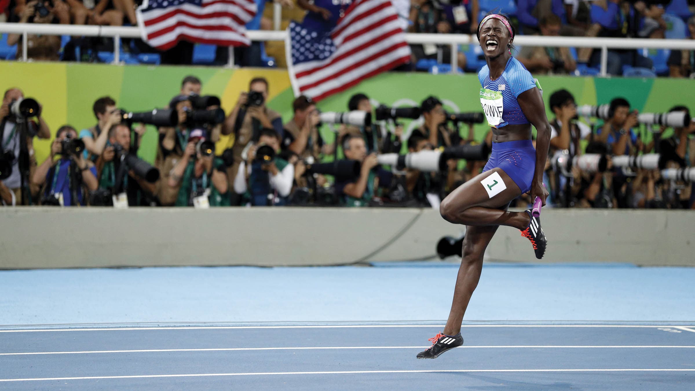 Tori Bowie screaming triumphantly mid-stride