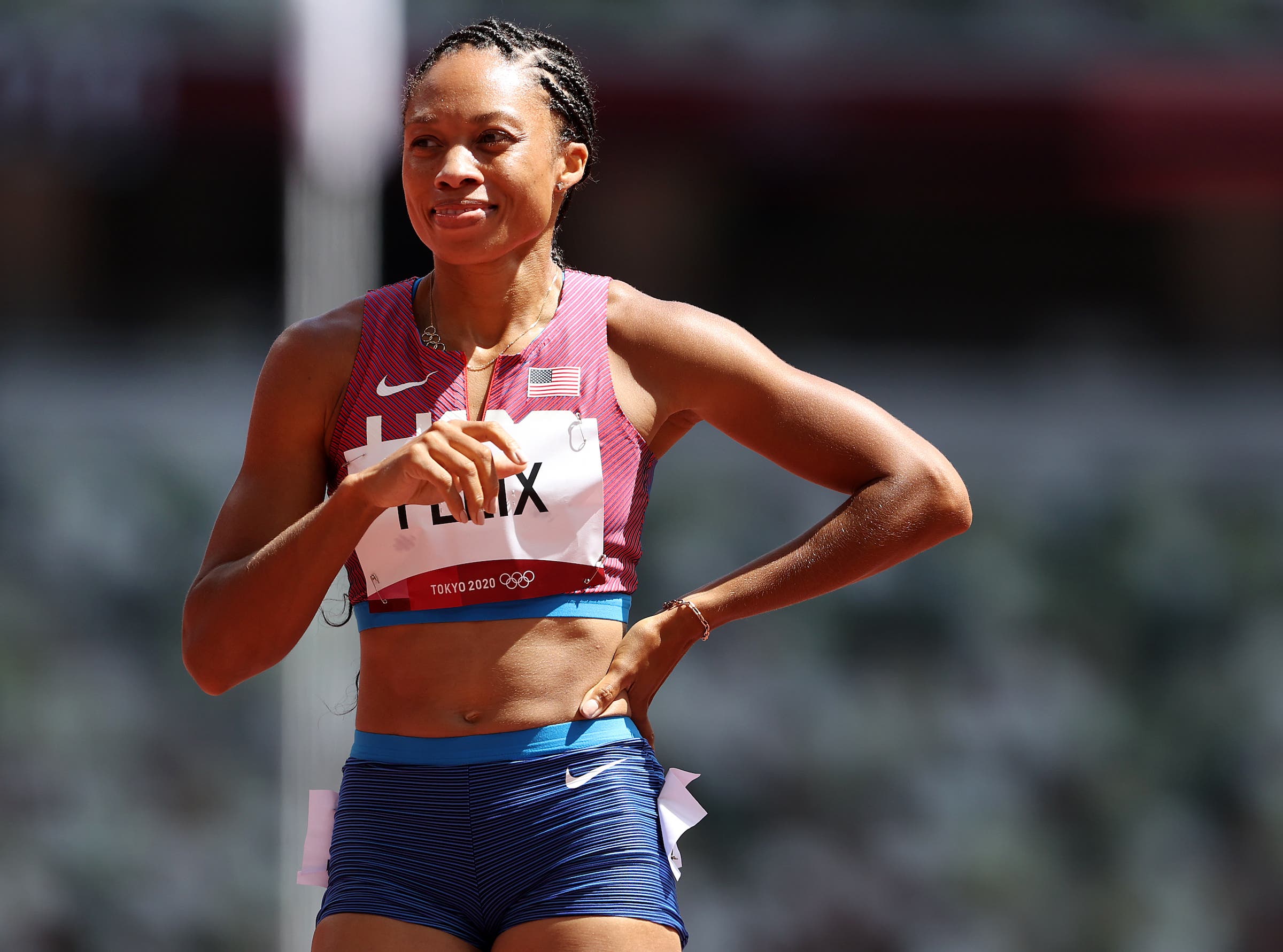 Allyson Felix runs in the first round of the 2021 Olympics