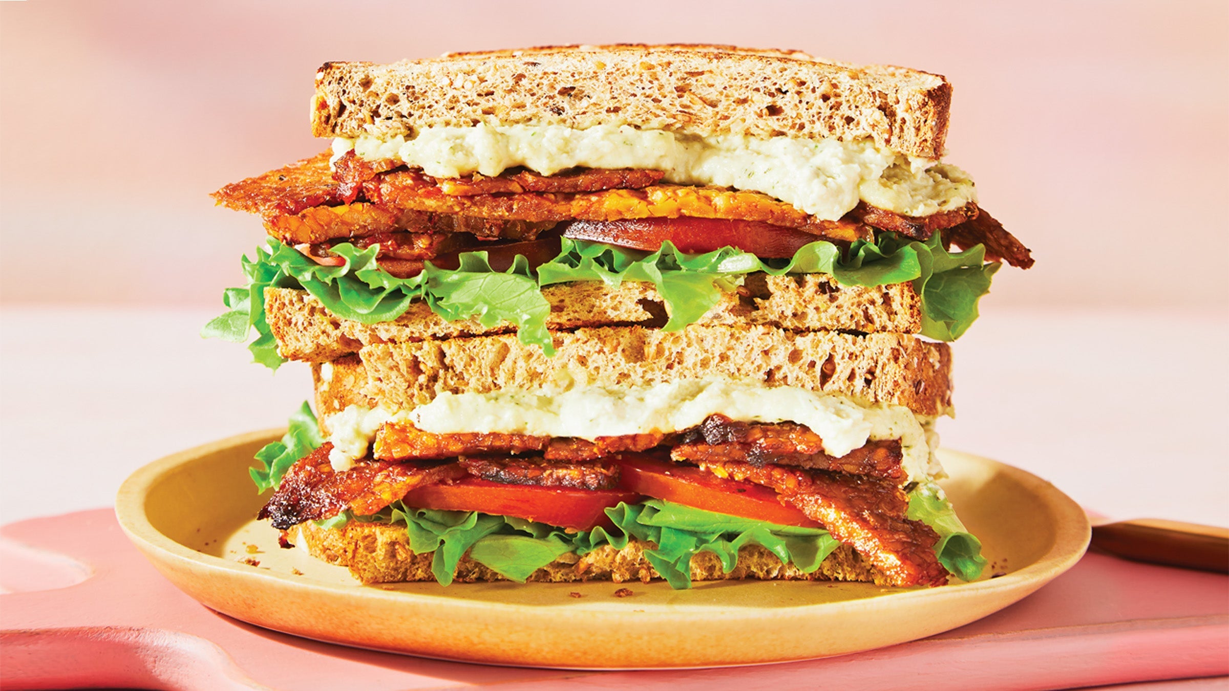 Tempeh BLT with Cashew Ranch Sauce on a plate