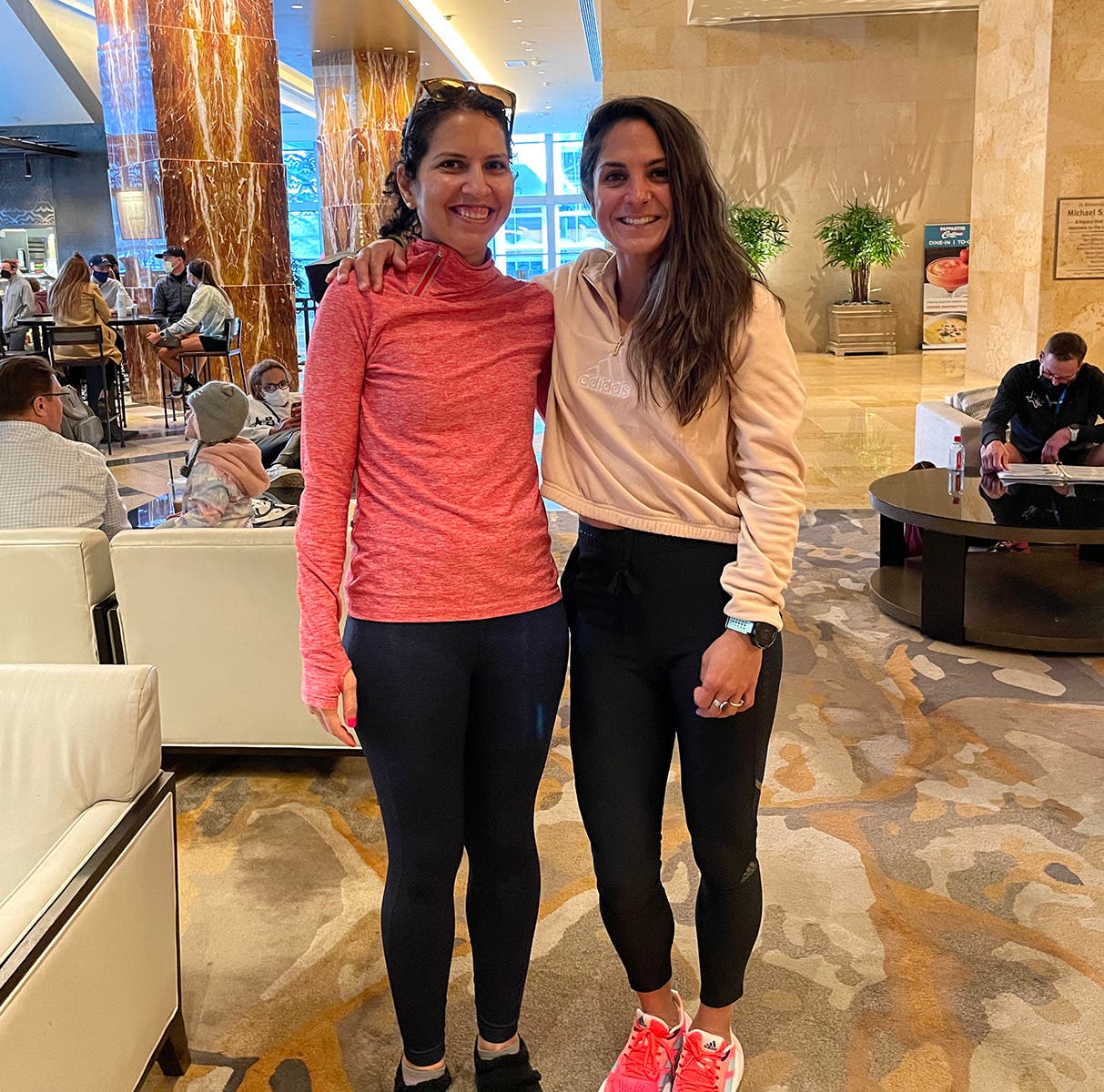 Emilia Benton poses with running coach Nell Rojas before the Houston marathon