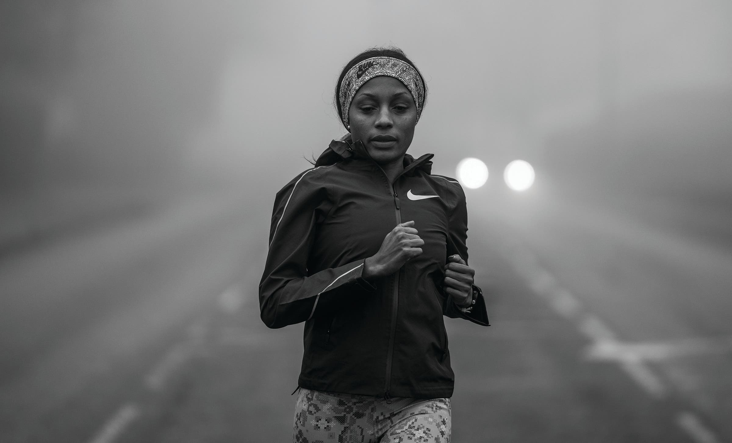 Mary Ngugi running on a misty road