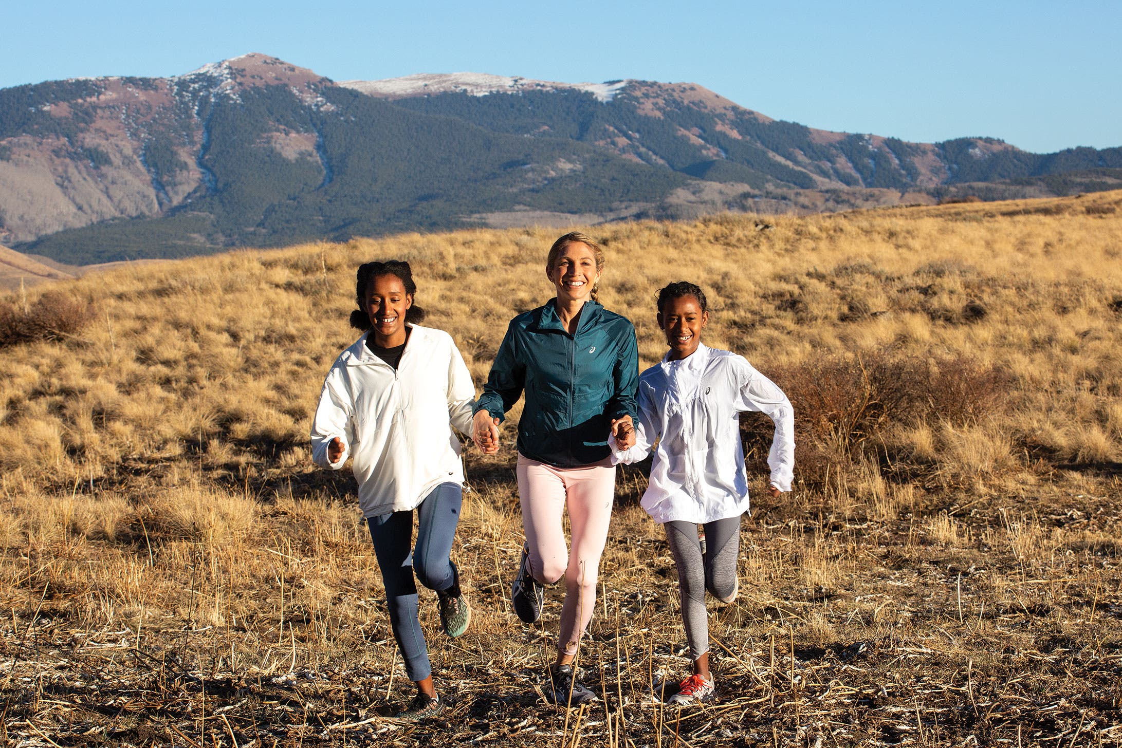 Sara Hall running with two of her daughters