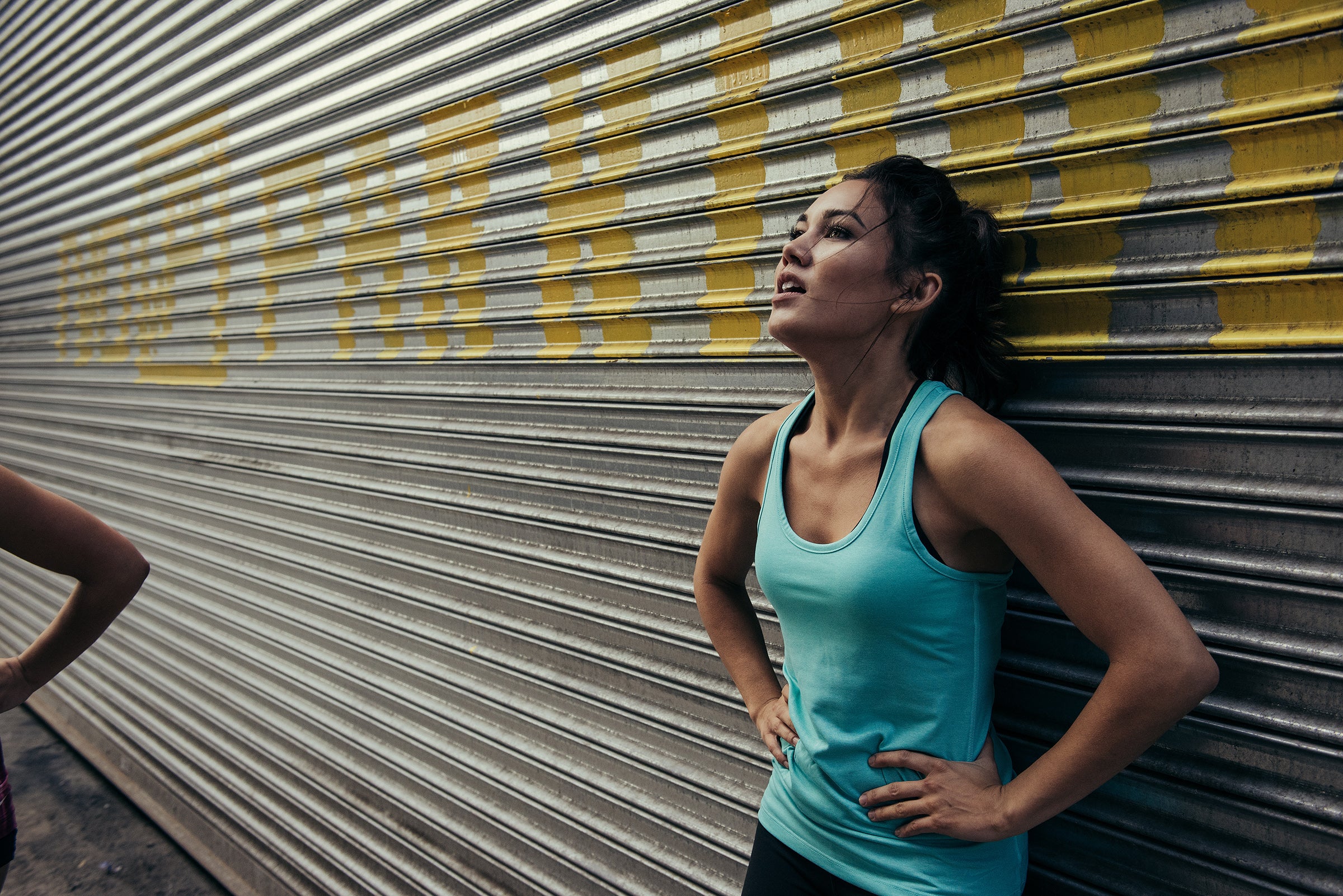 Young woman exhausted after putting a lot of effort into a run