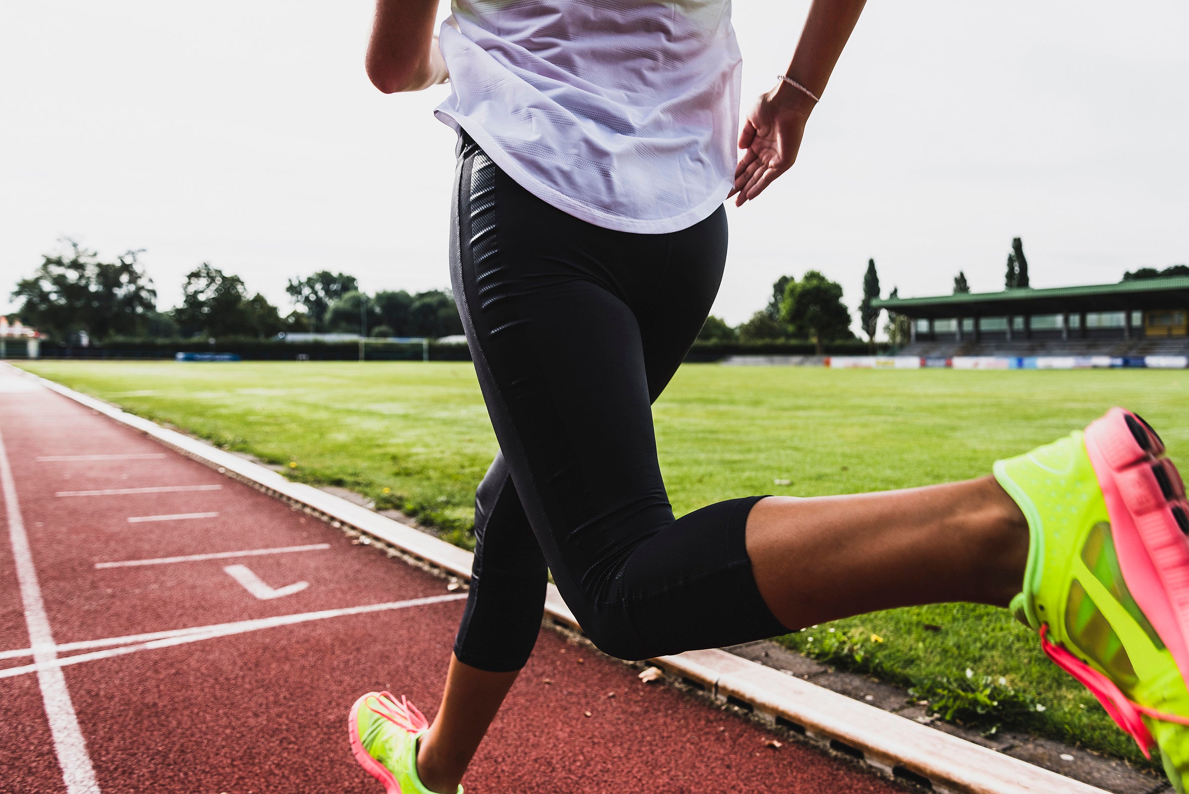 woman running in a classic track workout