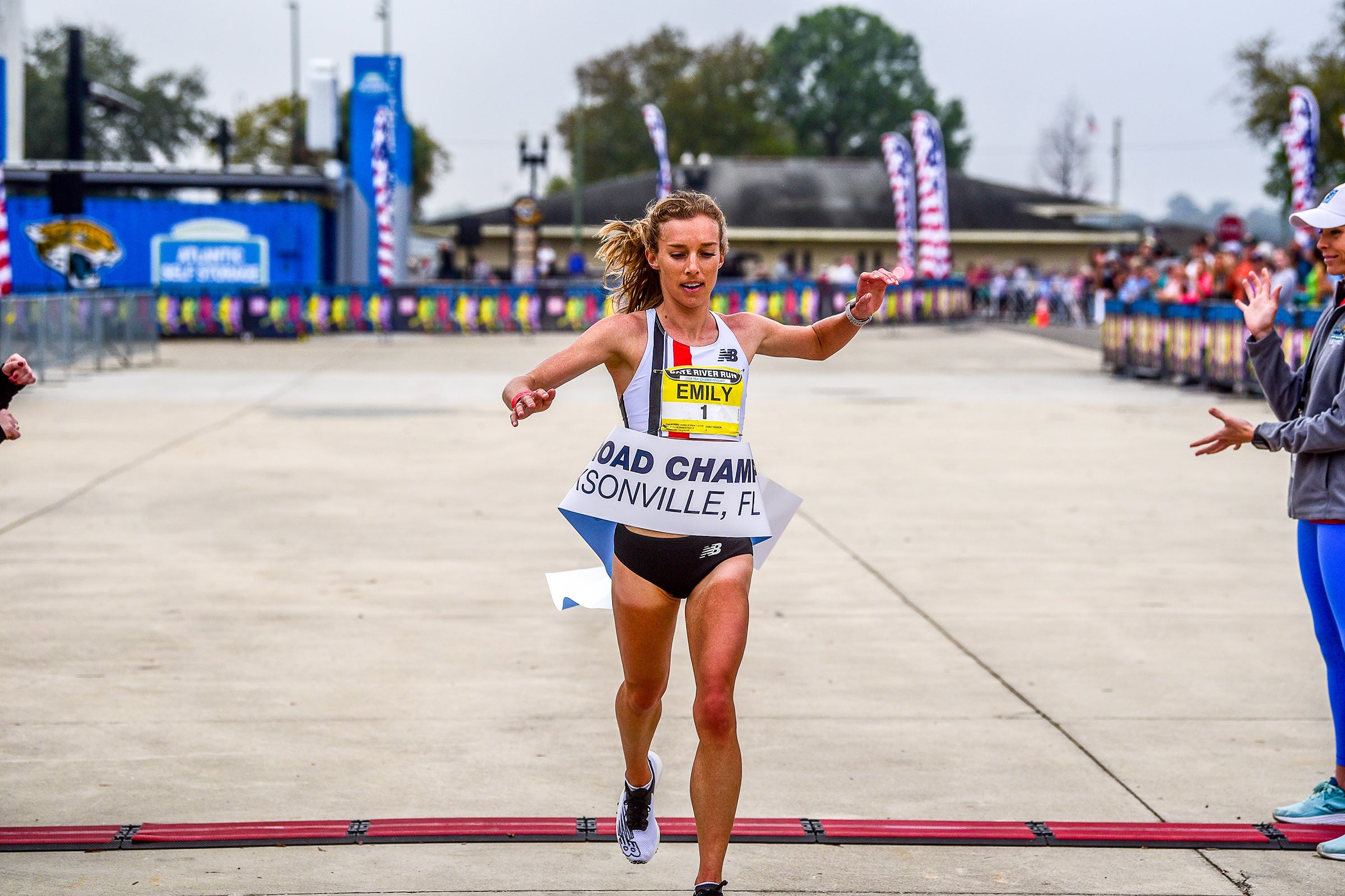 Emily Sisson breaking the tape at the 2022 USATF 15K Championships