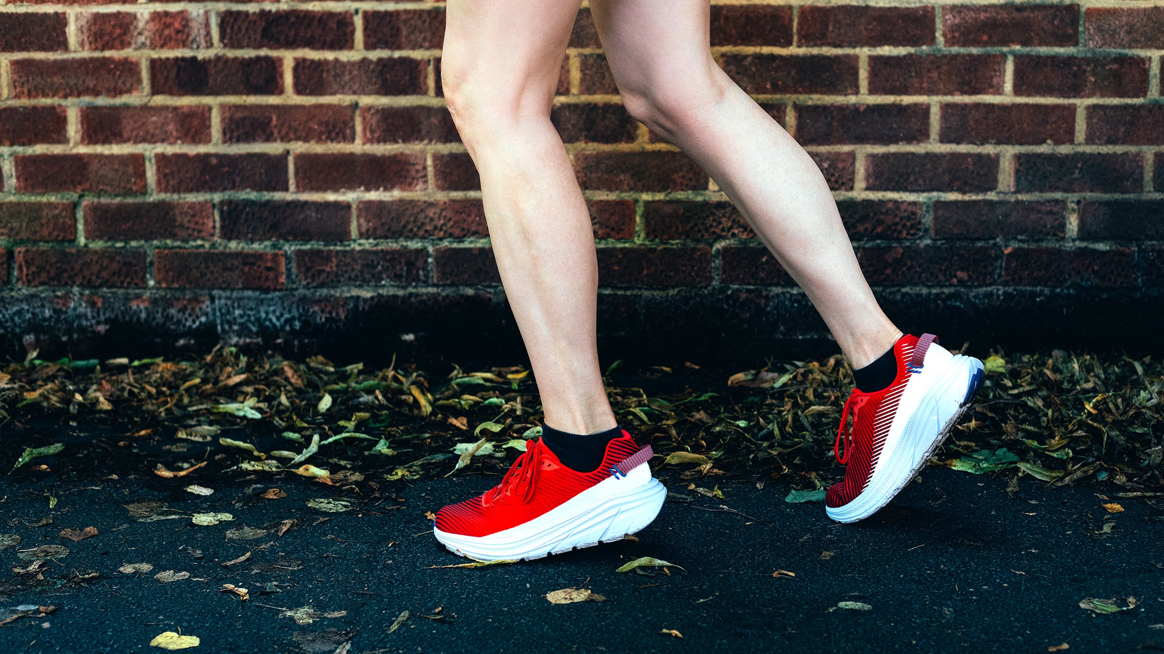 Low section view of a woman runner's legs wearing running shoes for women