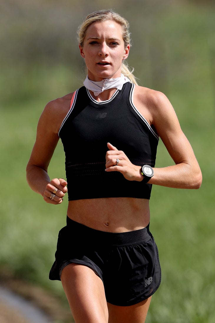 Emma Coburn running face-on demonstrating proper arm form for running