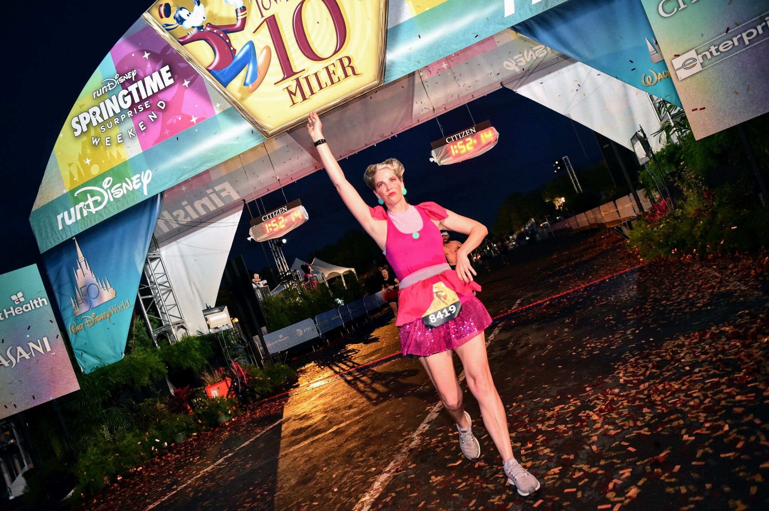 white woman dressed as Lady Tremaine at the finish line to one of the races during the Springtime Surprise Weekend