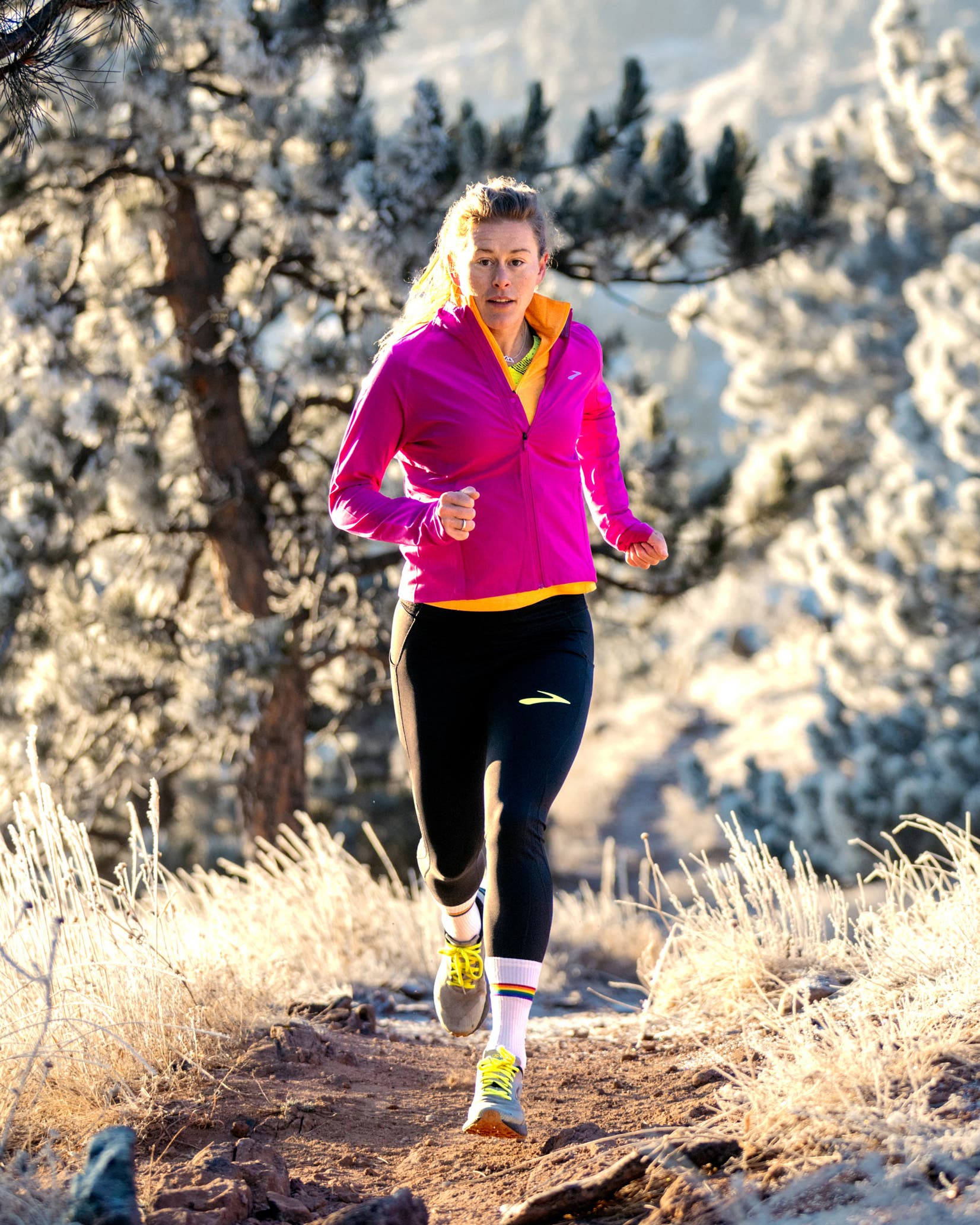 Hillary Allen running on a trail in winter